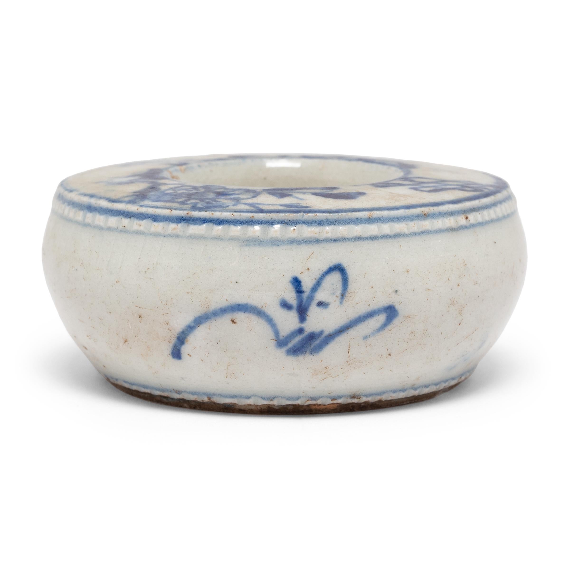 Alongside the Four Treasures of a Chinese scholar - paper, brush, ink, and inkstone - this delicate porcelain water coupe likely once resided on the desk of a great calligrapher. Created in the mid-19th century, this petite coupe would have sat