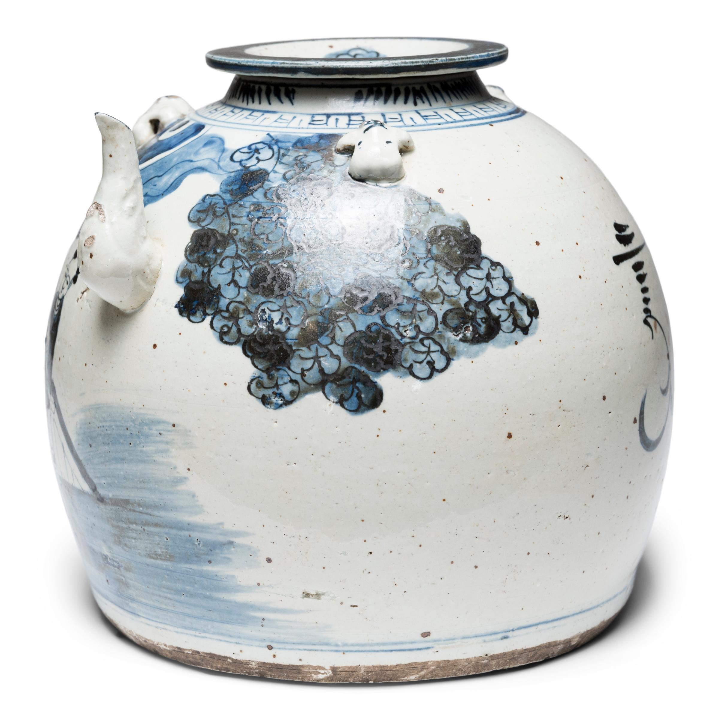 Brushed with a dark, blue-black glaze atop a white field, this Qing-dynasty water vessel is wonderfully painted in a carefree style with stylized figures and loose shading. Designed for serving water or tea, the squat jar has a rounded form with a