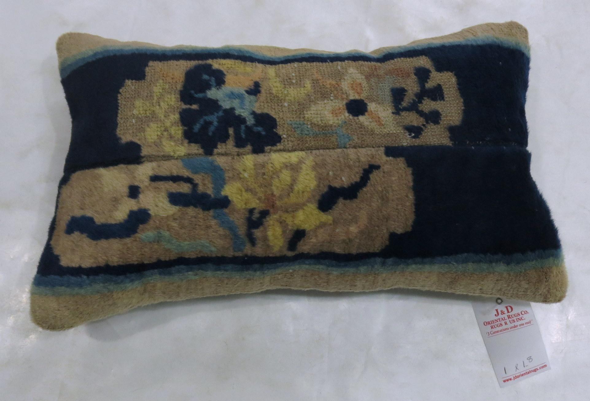 A pillow made from an early 20th century Chinese Peking rug.

Measures: 12'' x 20'.