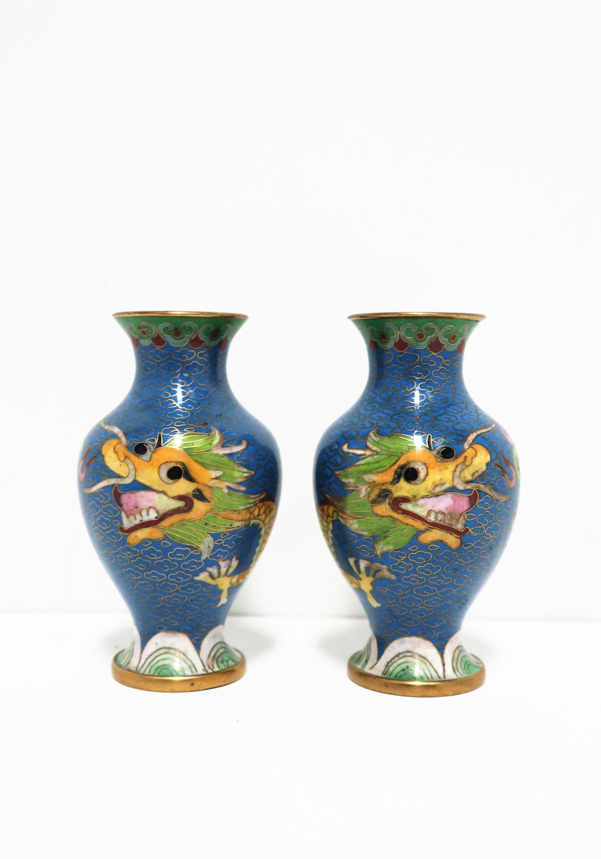 A very beautiful pair of Chinese brass and cloisonné enamel vases with dragon design, circa early to mid-20th century, China. Vases are predominantly blue; Other colors include white, green, black, pink, red, yellow, and orange. Dimensions: 2.25
