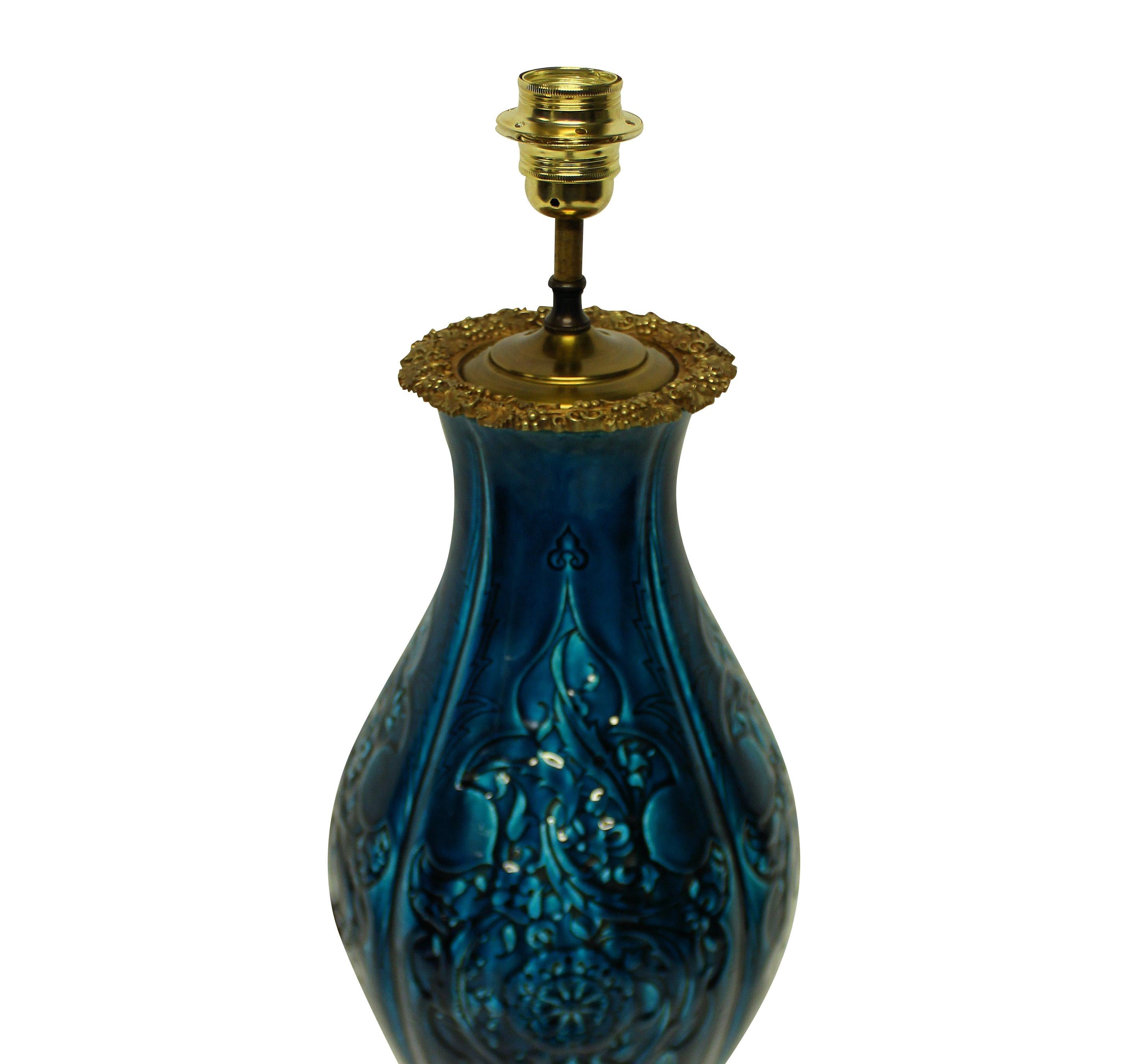 A Chinese blue glazed ceramic vase, mounted on an ormolu stand and converted into a lamp.
