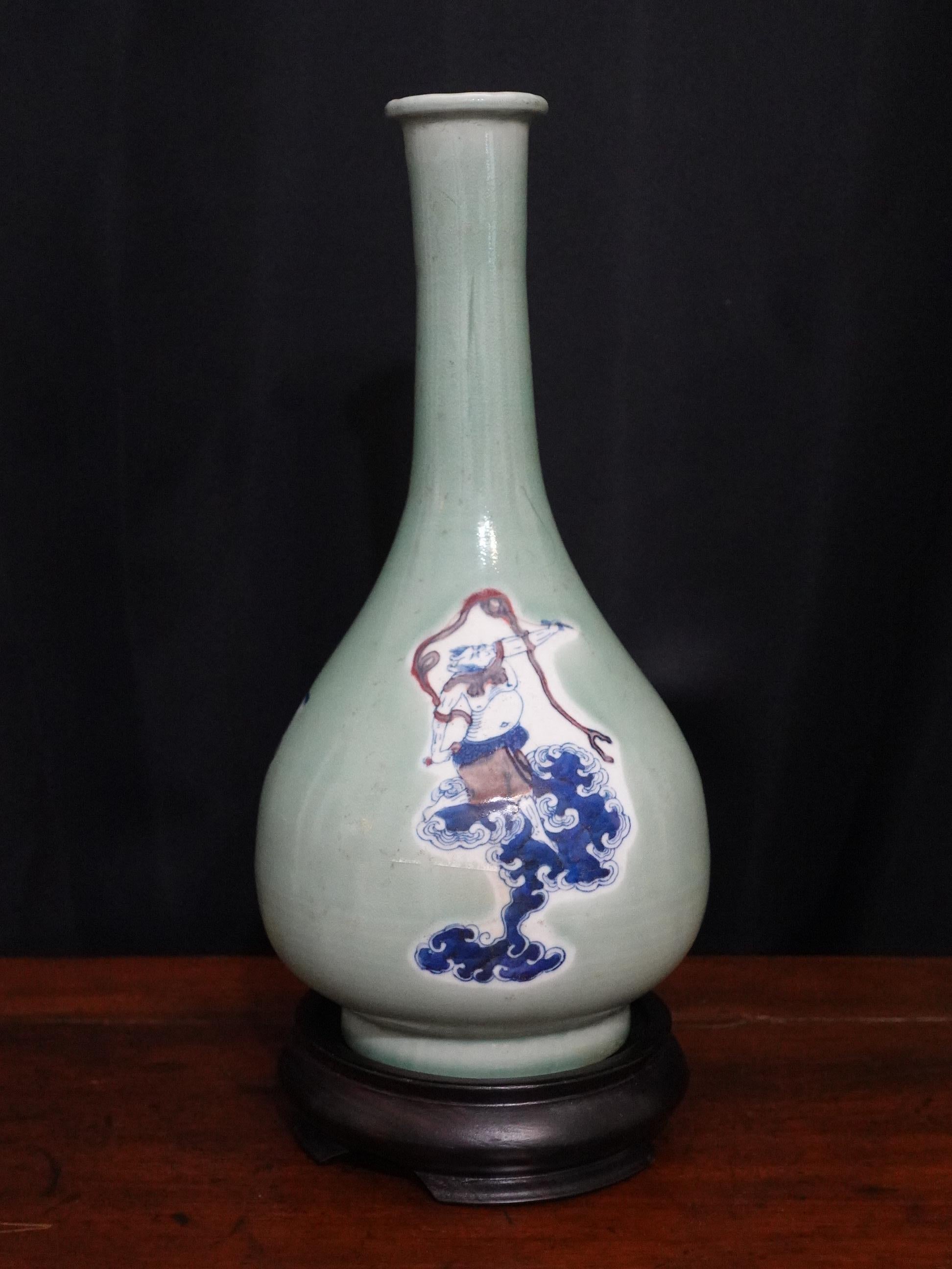 Chinese Blue White and Red Under-Glazed Long Neck Vase with Hardwood Stand.
Measures: Vase High is 12.5