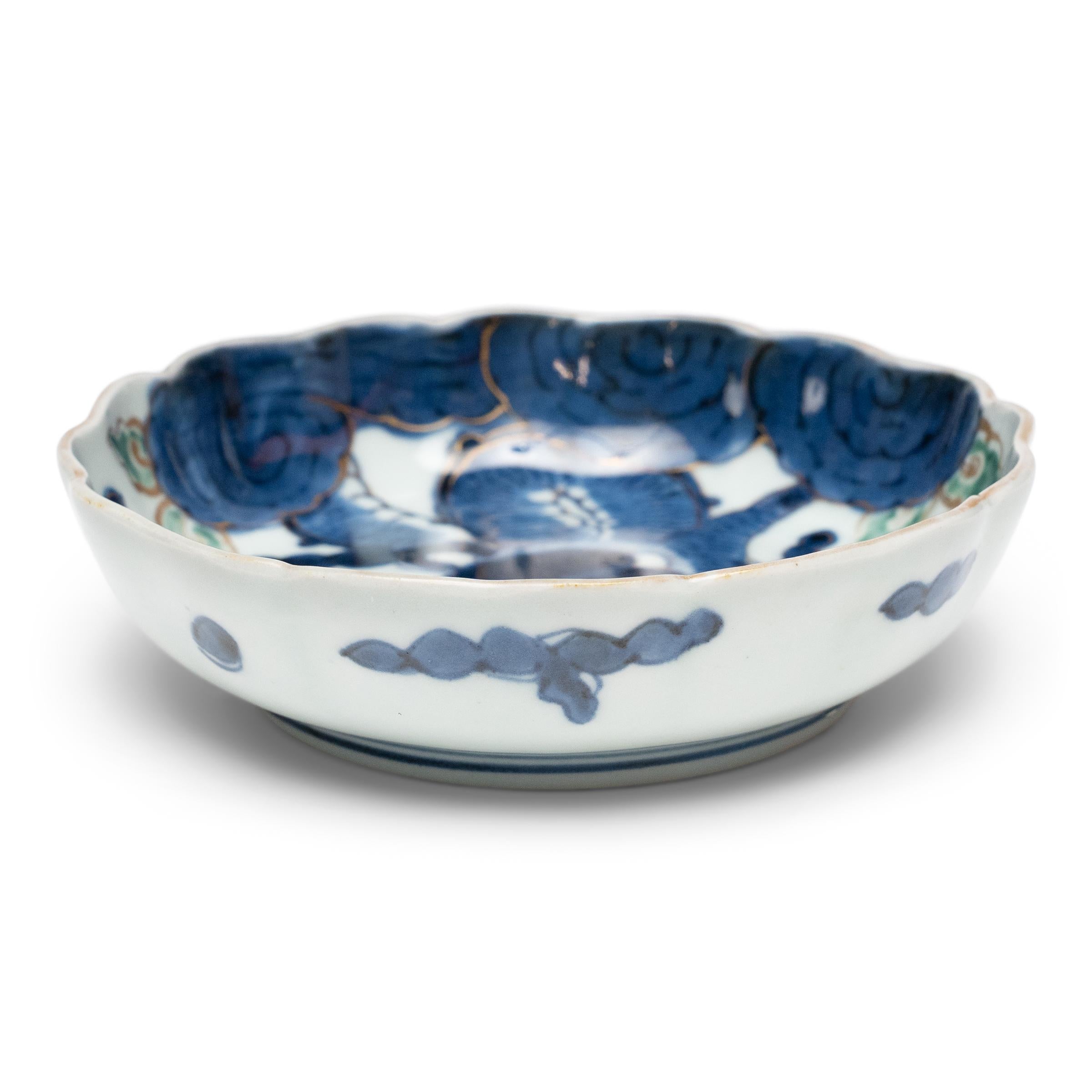 This small porcelain dish dates to the early 20th century and is decorated in the blue-and-white manner with a cobalt-blue dragon in pursuit of the heavenly pearl. Ranked first amongst mythical beasts, the dragon symbolizes strength, fertility and