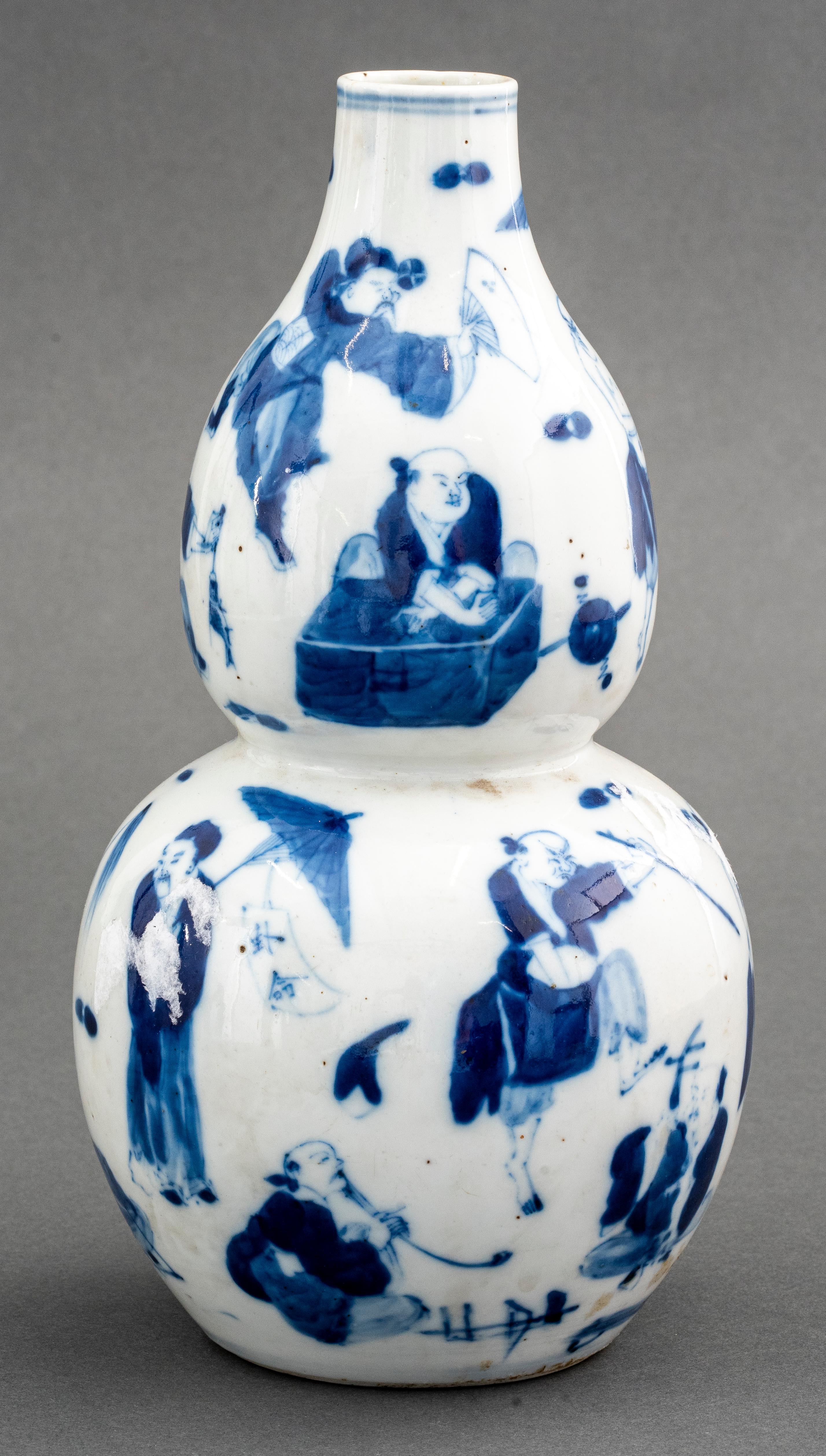 Chinese blue and white figural double gourd vase, marked.
