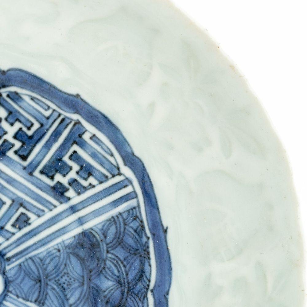 Pair of Chinese Blue and White Pale Celadon Porcelain Dishes, Ming Dynasty, 17th century, each with molded foliate design and cobalt blue geometric design to center. Each approx.: 1.25