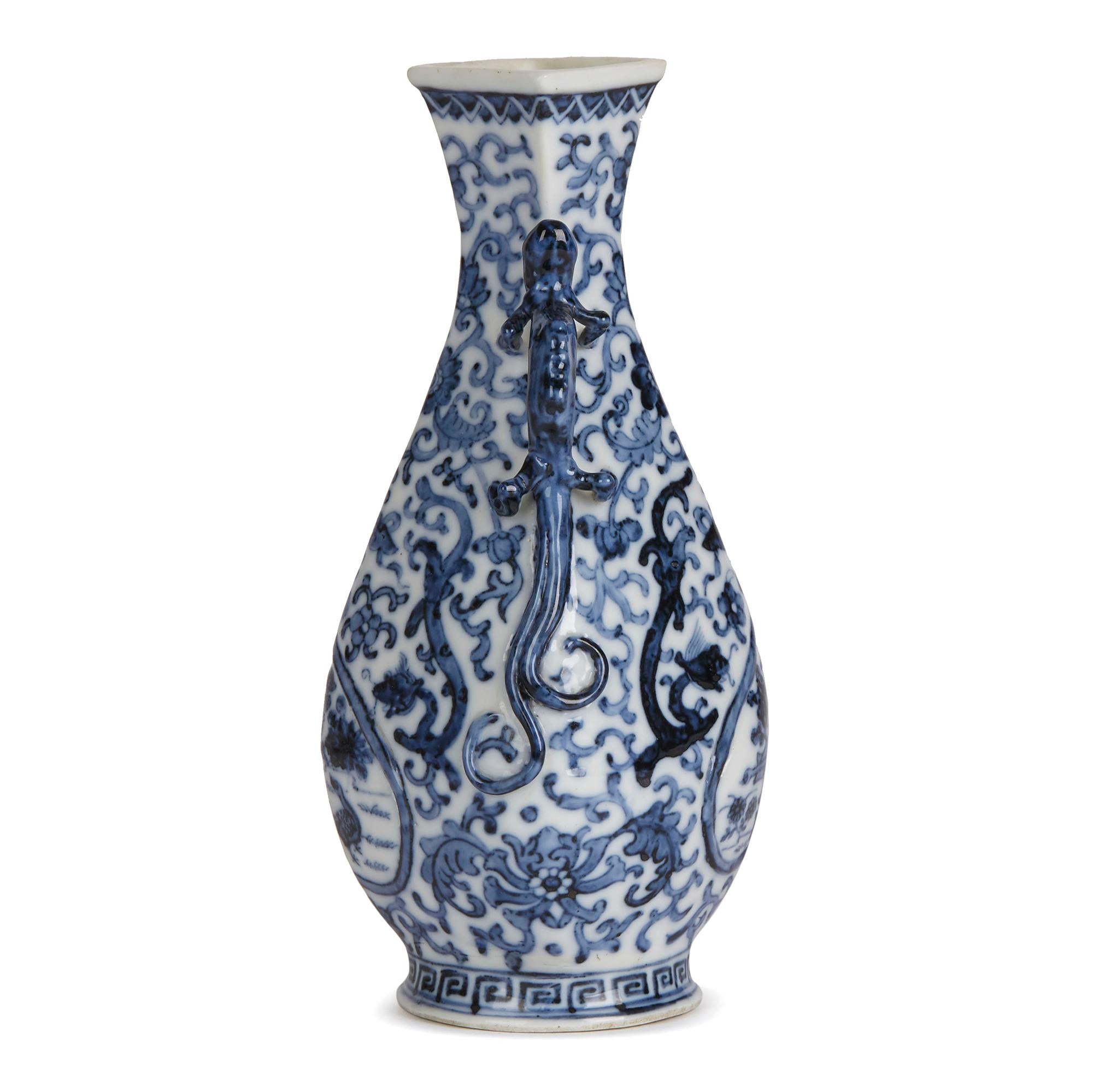 A Chinese blue and white porcelain vase with kylin handles decorated with moulded panels with birds and other designs set within a surround with floral and scrolling kylin designs with key border around the foot. The vase has a square shaped top