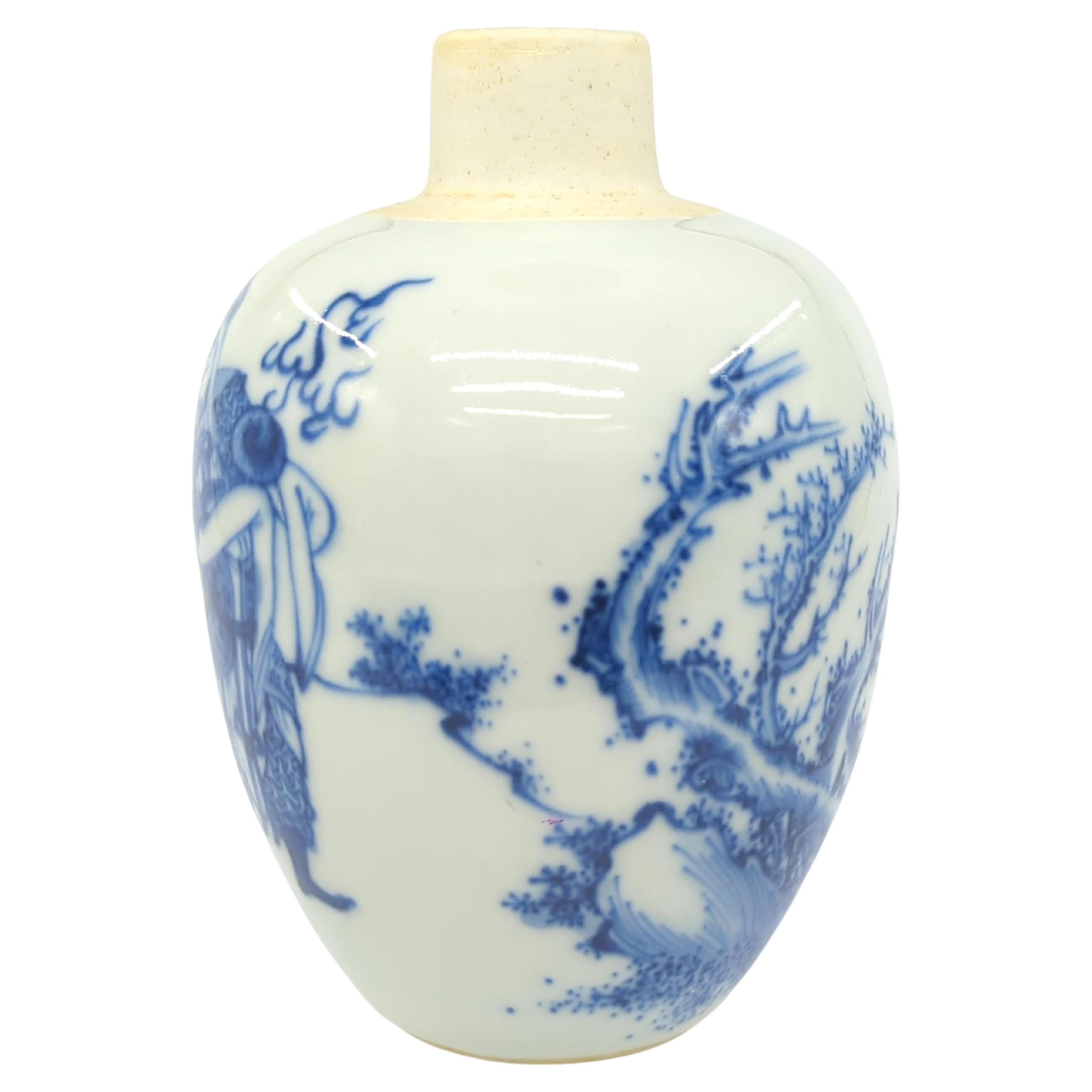 This petite Chinese tea jar is a remarkable example of blue and white porcelain craftsmanship. Standing at a height of 4 1/2 inches (11.5 cm), the ovoid form jar features a captivating design that includes a majestic Qilin (Kirin)  and a General,