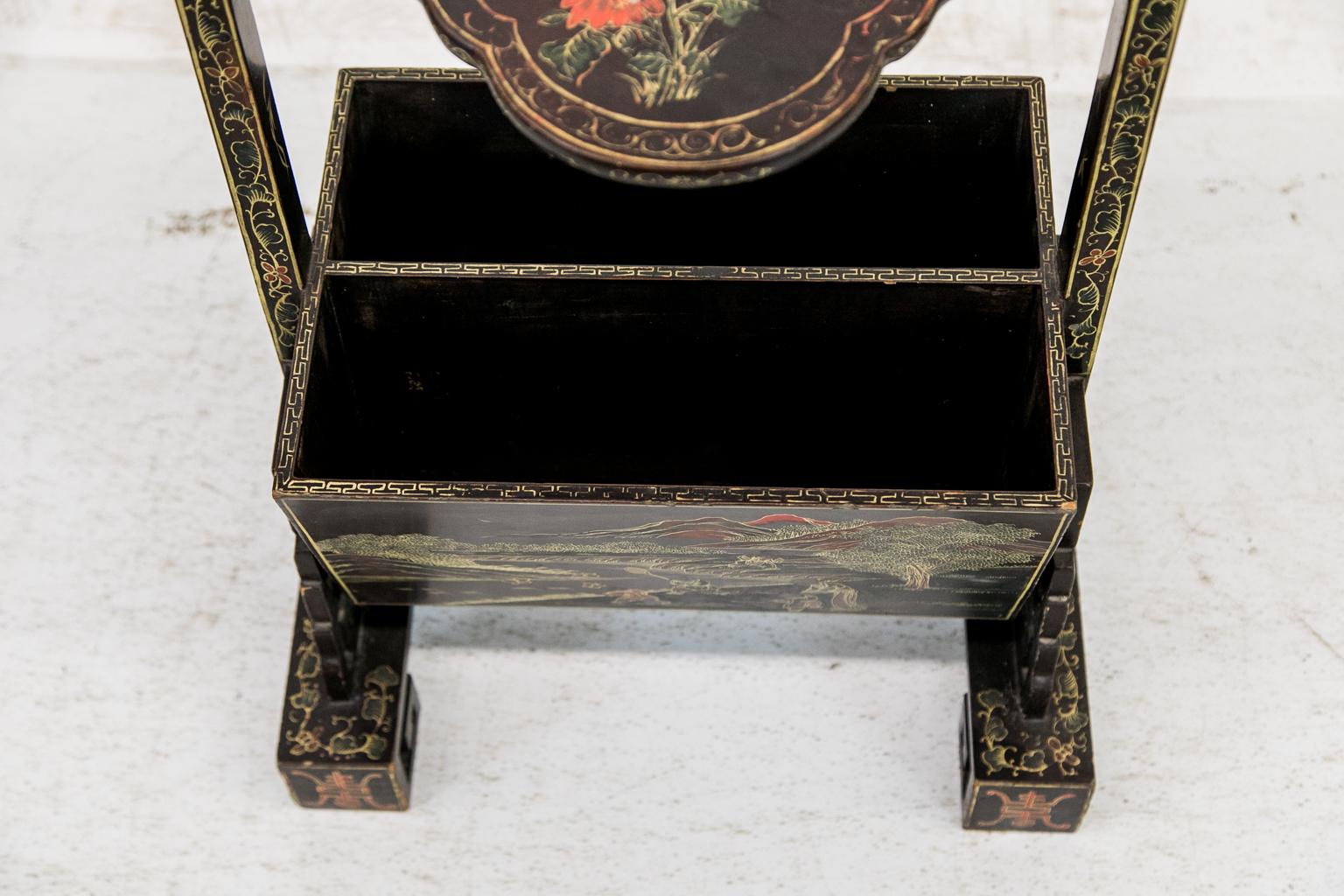 This rack is decorated with green and red floral, vine, and geometric motifs with gold highlights throughout. The side supports have carved geometric double brackets on each side which rest on geometric scrolled feet.