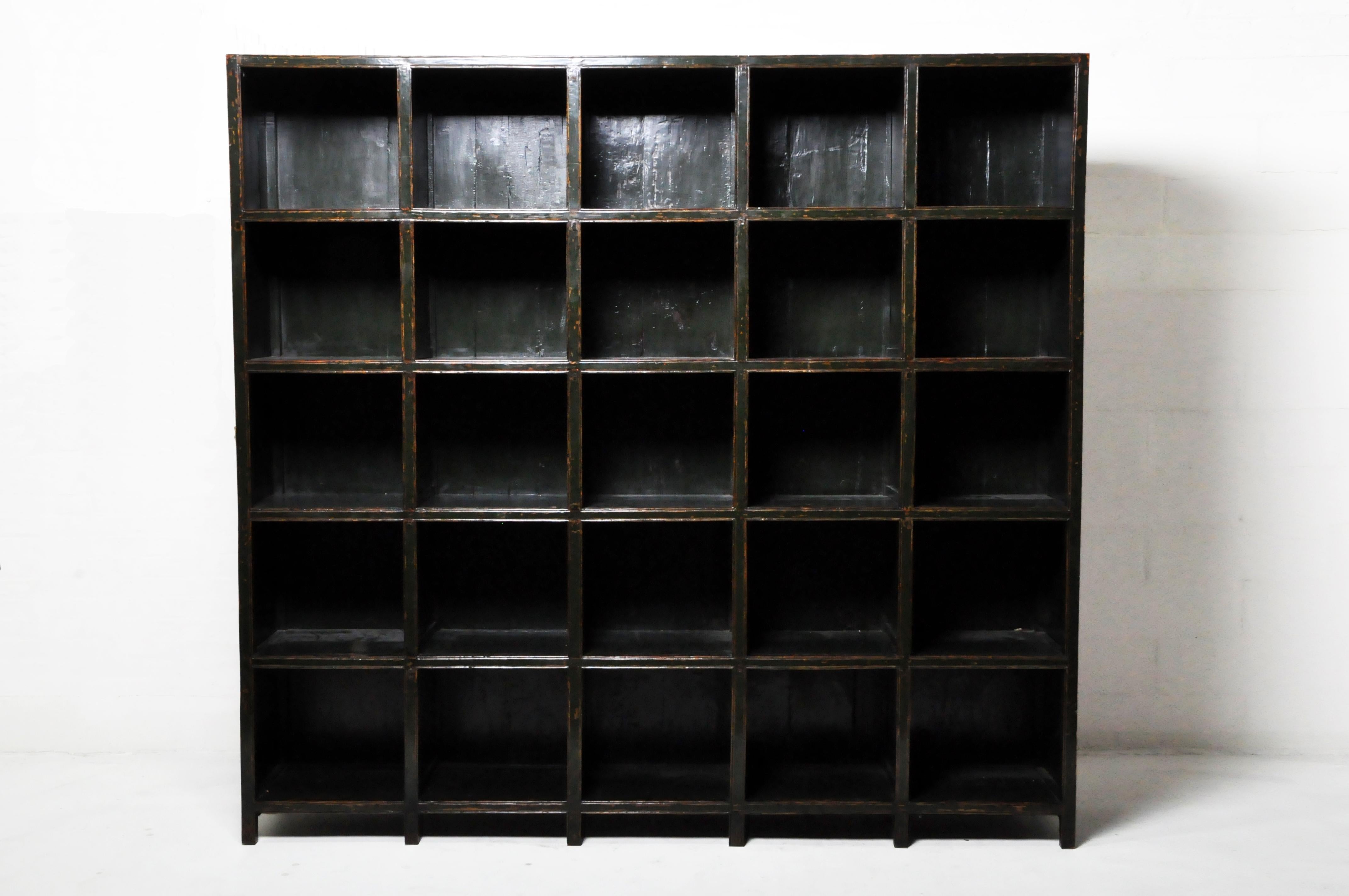 Chinese scholars, aristocrats, and wealthy merchants collected books and historical objects and placed them in a room dedicated to calligraphy and contemplation. This simple bookshelf was once placed in such a room, adjacent to an outdoor courtyard.