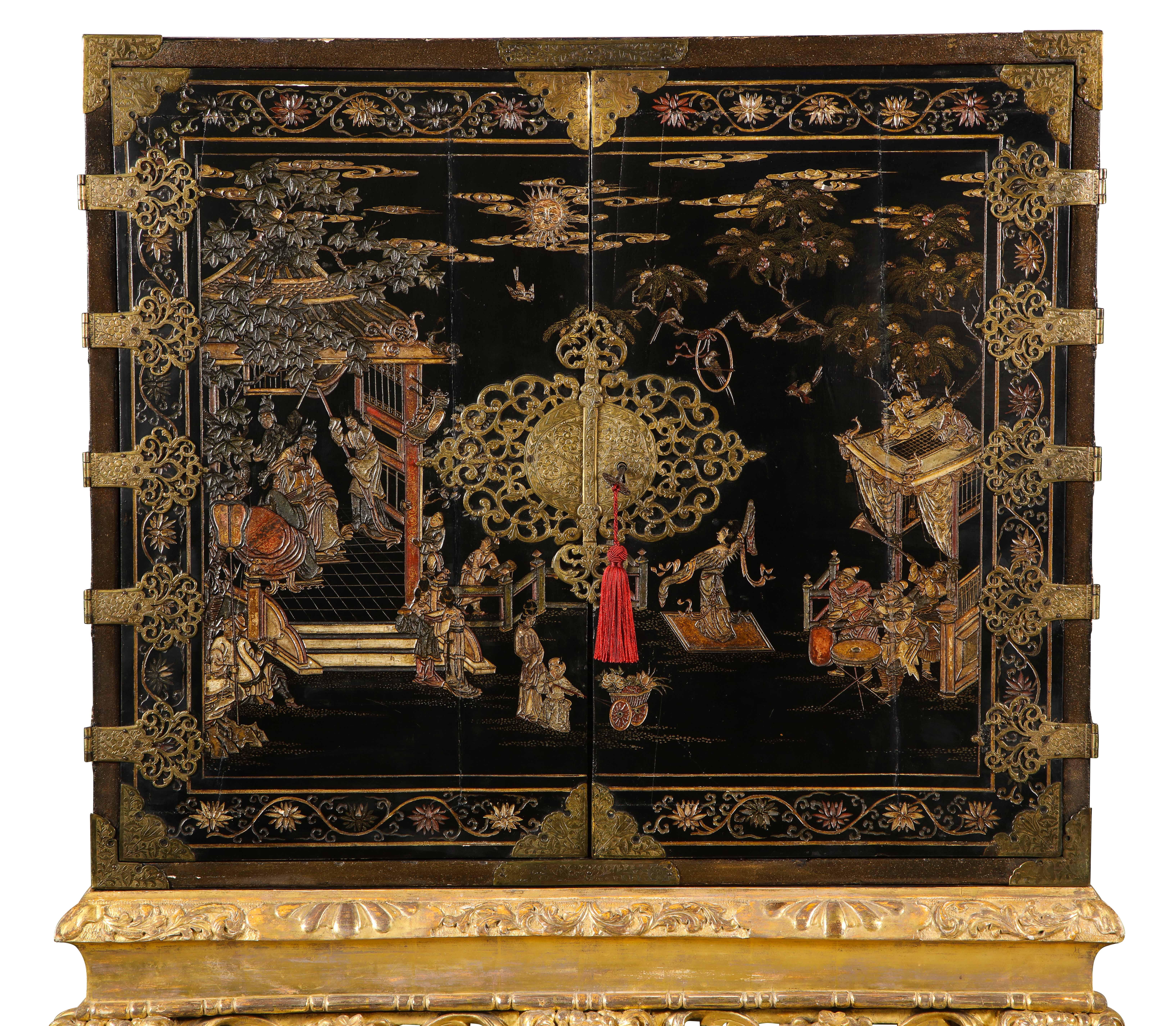The cabinet doors decorated with court scenes with pierced foliate hinges & lock plates enclosing eleven drawers decorated with different scenes, all on a giltwood stand.
Provenance: The 2nd viscount Camrose, Hackwood Park, Basingstoke,