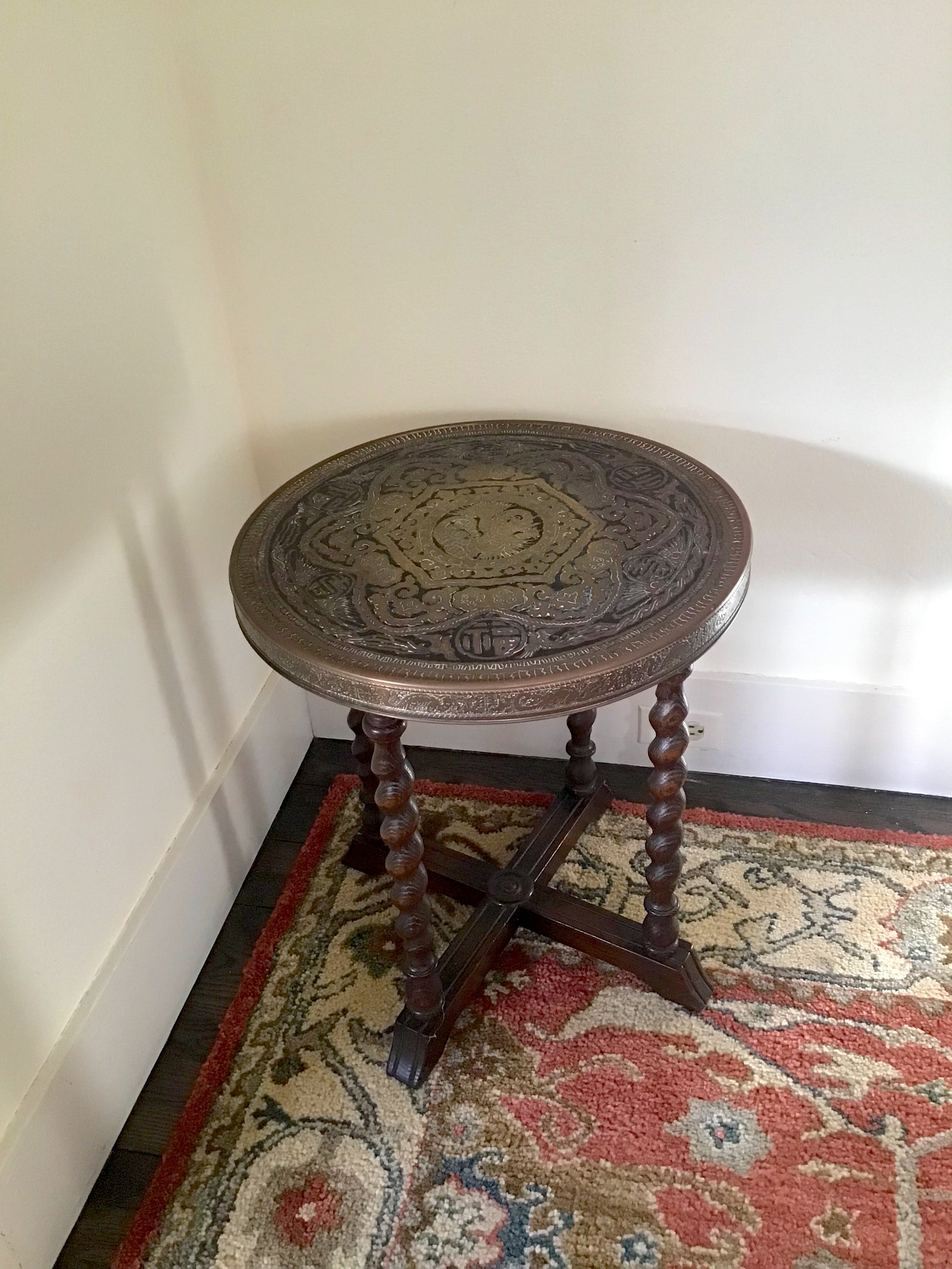 A victorian era Ferguson Brothers side table with brass engraved top in Chinese dragon motif with turned legs in oak.