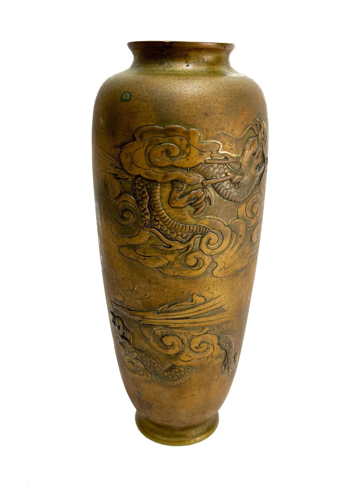 Chinese Bronze Etched Dragon Vase, Etched dragons in the clouds. Unmarked.

Additional Information: 
Type: Vase
Composition: Bronze
Weight Approx., 1.5 lbs
Measures Approx., 4 inches diameter x 9.75 inches


Condition: Great condition. Surface wear.
