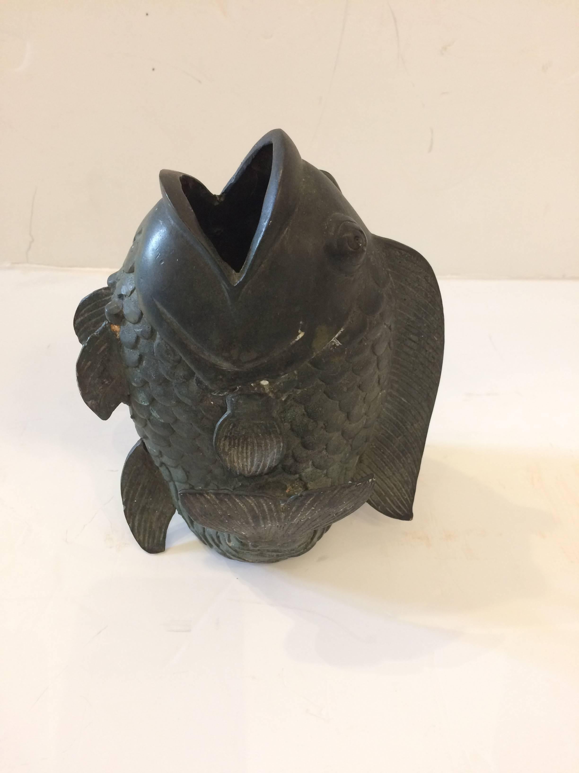 Great looking object d'arte vase in the shape of an open mouthed fish having great detailing and verdigris patina.