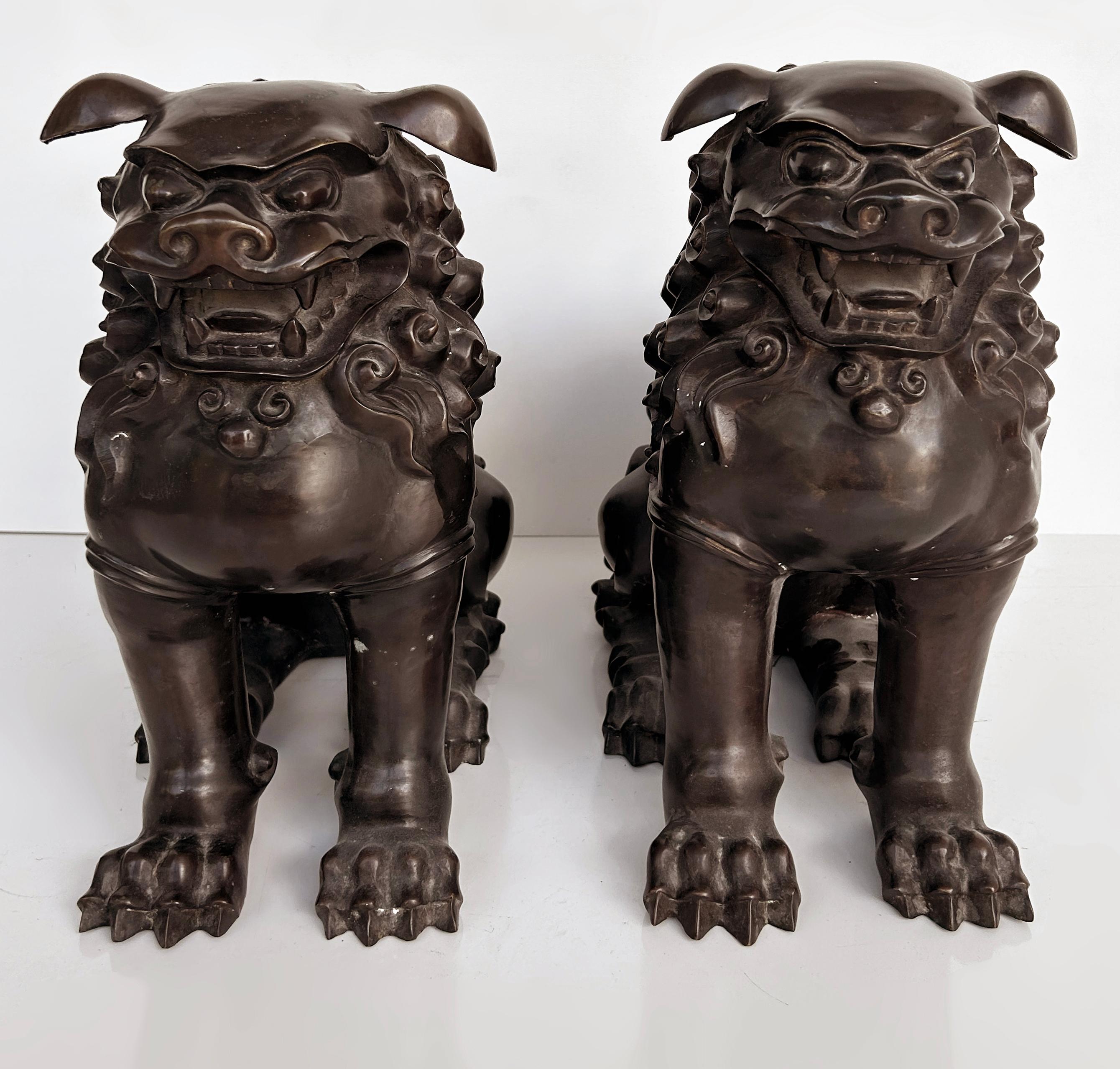 Chinese Bronze Foo Dogs Sculptures, a Pair

Offered for sale is a pair of fine Chinese bronze well-made and cast foo dog sculptures. They both have a wonderful dark patina and a sharp casting clearly from a good foundry. The air is substantial and