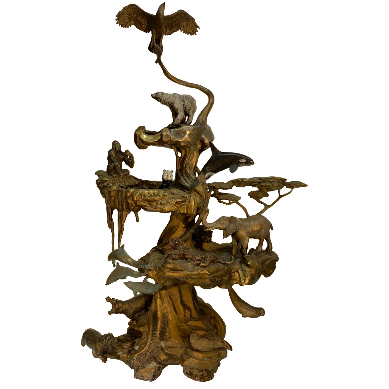 Chinese bronze fountain with animals and in the shape of a tree.
The fountain displays an eagle with a fish in its claws, a polar and panda bear. Its shows a gorilla, an elephant, a hippopotamus, a tiger, dolphins, a killer whale and finally a seal