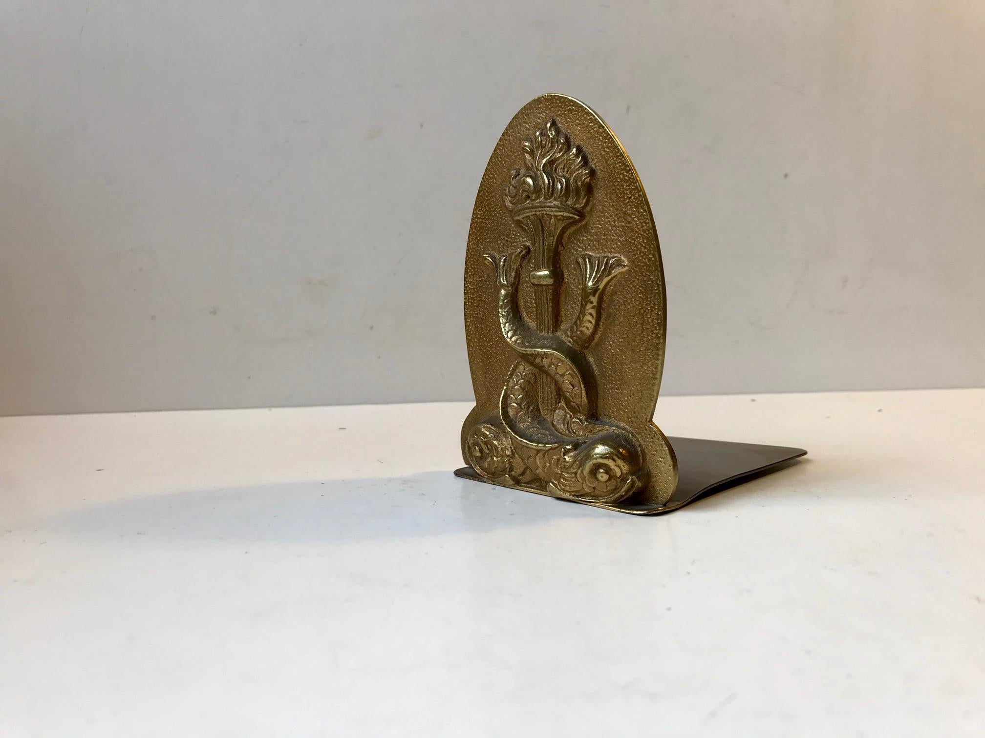 Old Chinese bronze bookend with a monogram of dolphins around a torch. It dates to circa 1930-1940. Unknown maker. No markings.