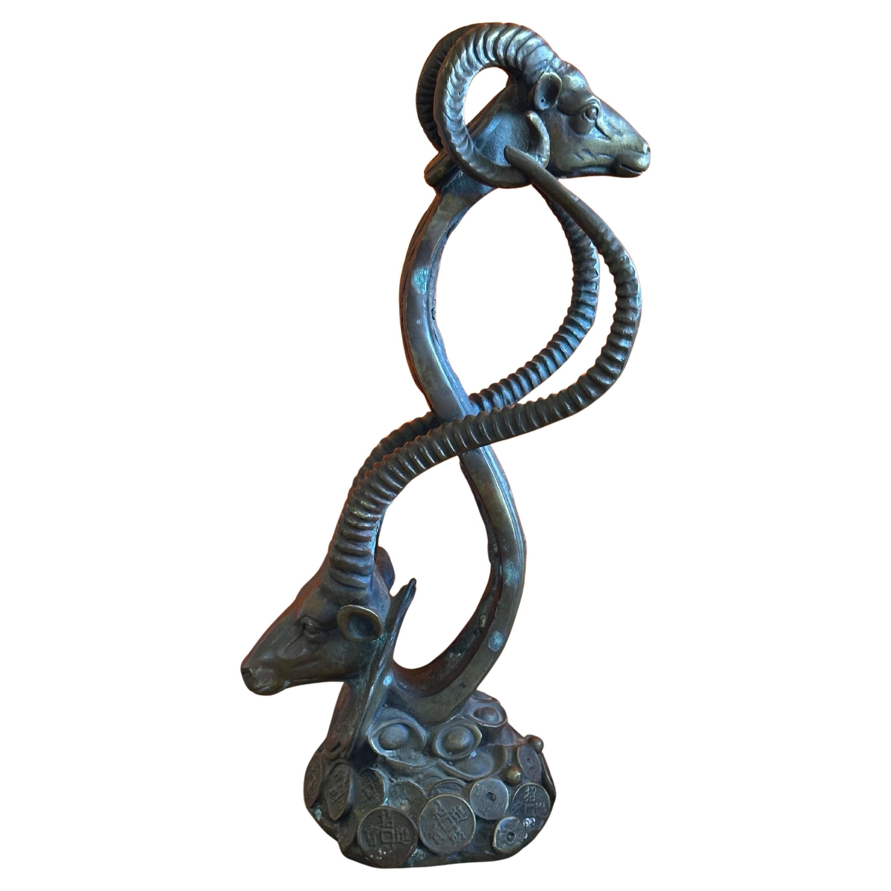Chinese Bronze Ram and Gazelle Sculpture with Intertwined Horns and Coin Base