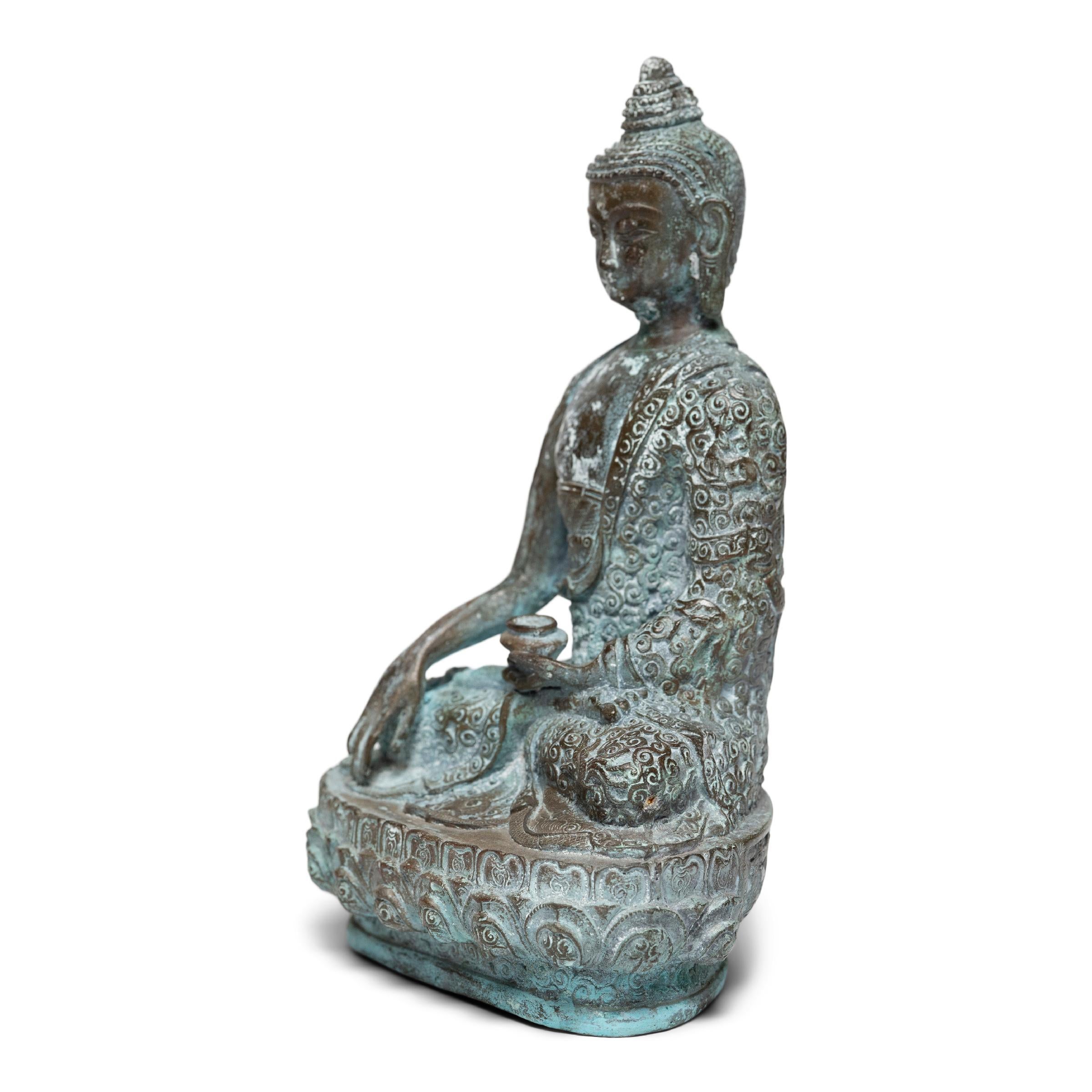 Dated to the Qing dynasty, this 19th-century bronze figure depicts the historical Buddha, known also as Shaka, Shakyamuni, or Siddhartha Gautama. Seated upon a double lotus base with a delicately flowing robe and elaborate coiffure, the Buddha