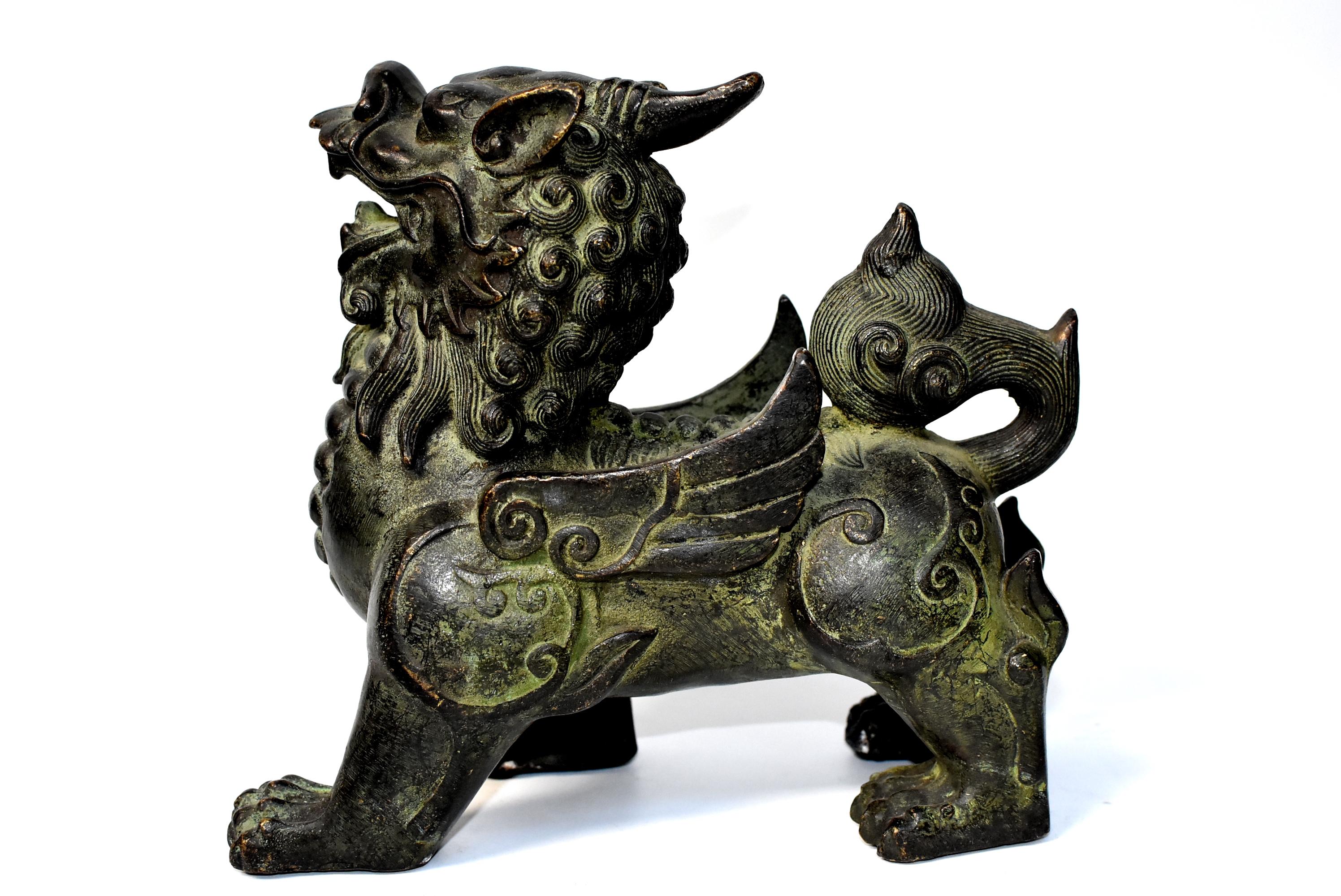 Pair of beautiful, large bronze Pi Xiu. The Pi Xiu is a Chinese mythical hybrid creature, a strong, winged lion. It is a powerful protector of practitioners of Feng Shui, also an influential and auspicious creature for wealth. These statues are