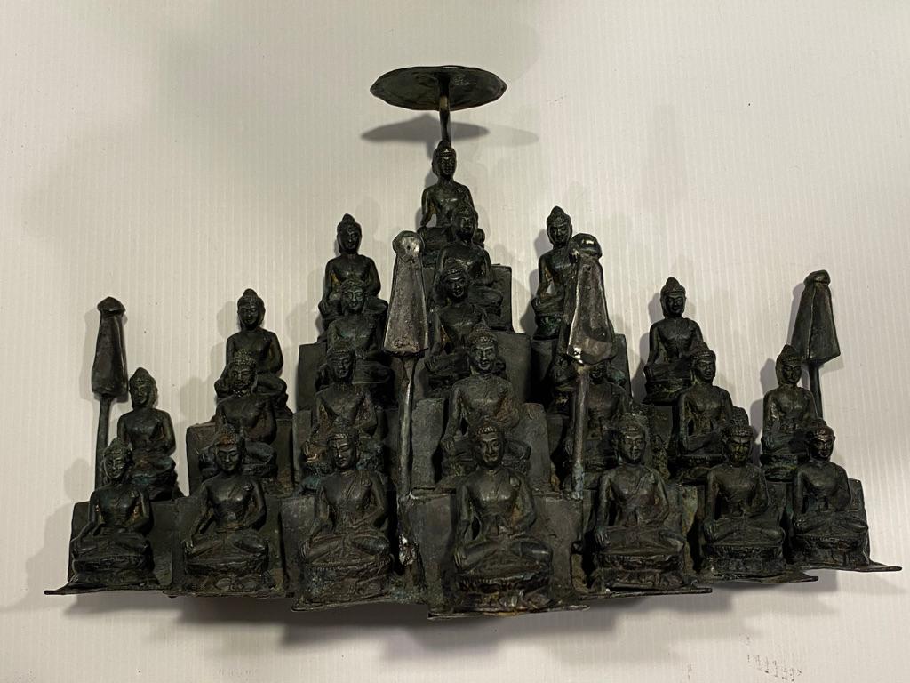 This antique bronze cast of Chinese temple 22 Buddha’s sitting position all liked together on one
(lost wax process method) shows well with the top Buddha under an open umbrella with a closed umbrella to each side. This is from an extra large