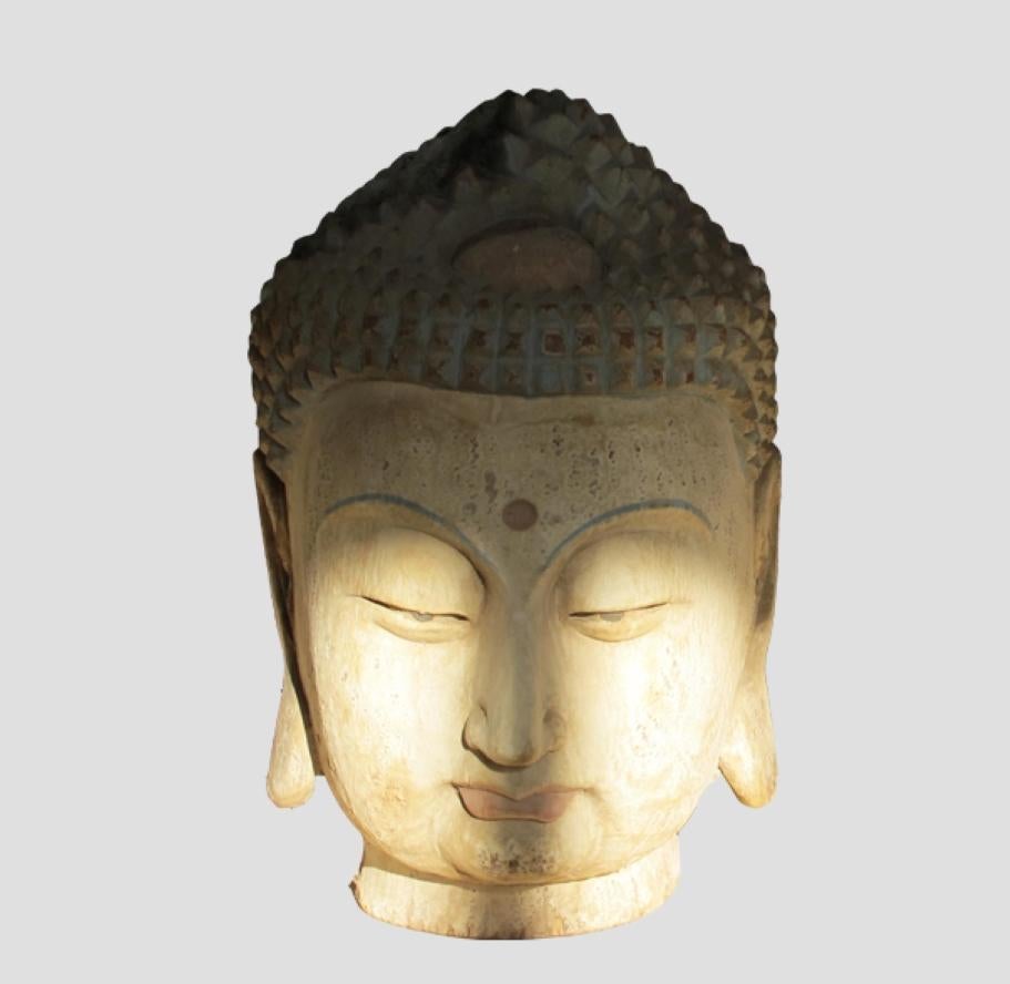 This Chinese Buddha head was rescued from a collapsing temple. It was beautifully carved with the faded polychrome headdress and rich patina. It is in great condition. It brings peace and love to places.