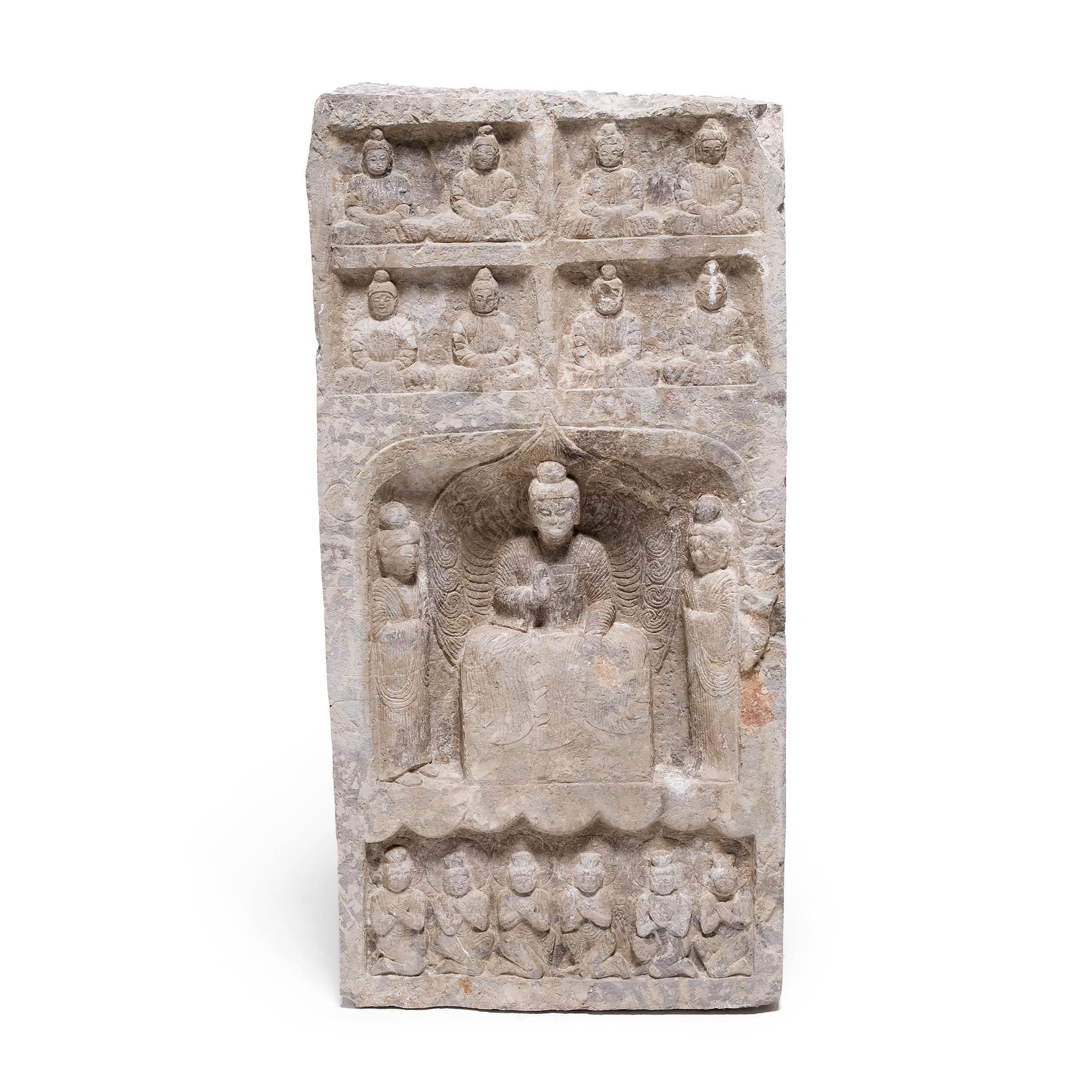 This incredible stone pedestal dates to the mid-19th century and likely originated as a stele monument or a segment of a large temple column. The square pedestal is carved in relief on all sides with Buddhist imagery in the Northern Wei style. A