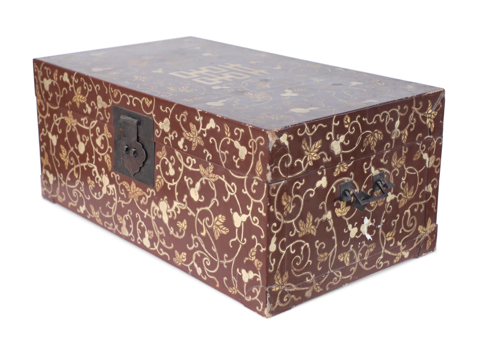 Chinese wrapped decorative box with a burgundy base with muted metallic gold gourd and leaf pattern on vines with a large central character, bronze handles and latch, and an interior lined in yellow floral shantung silk with a central stamp.