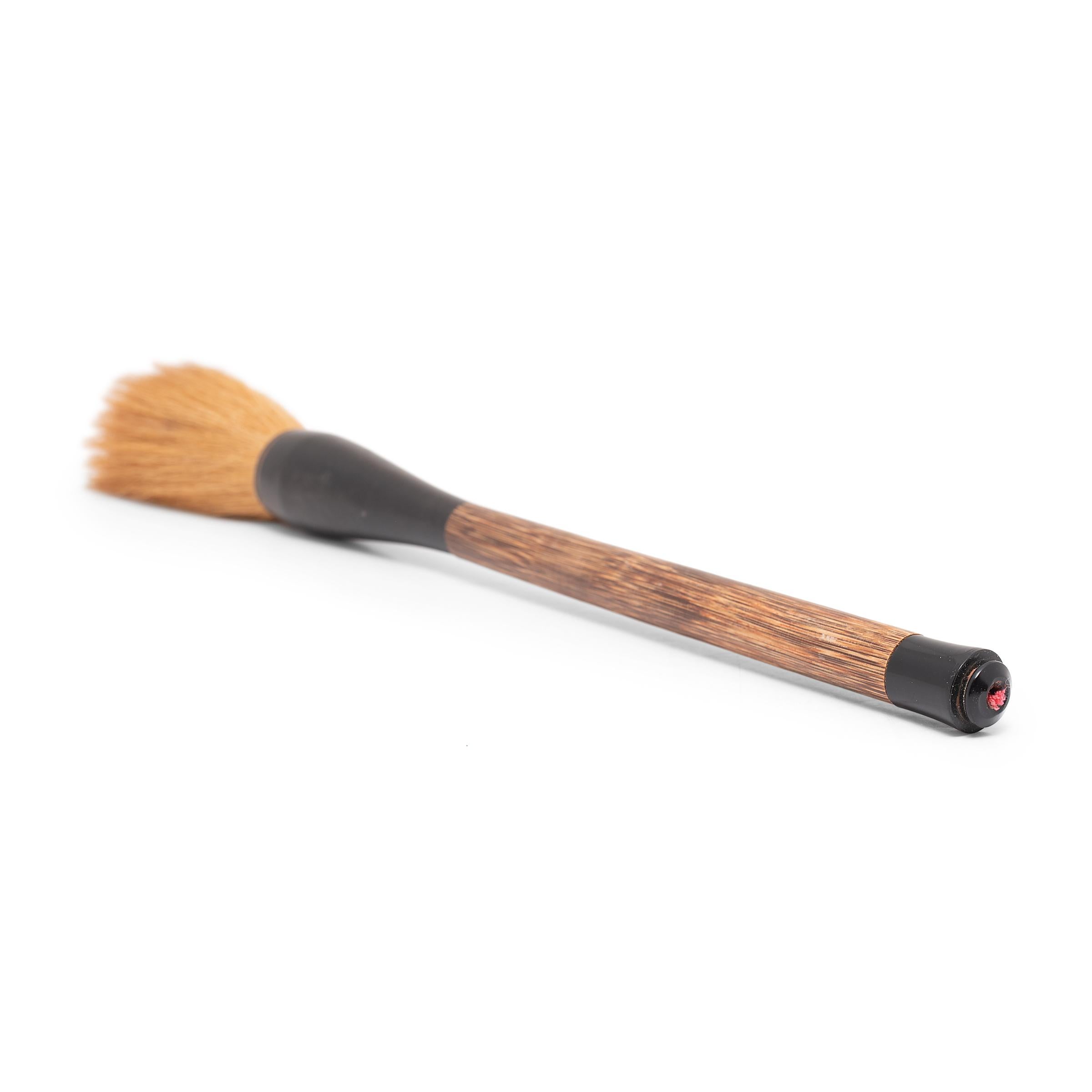 Along with paper, ink, and inkstone, the brush is one of the Four Treasures of the scholar’s studio. Arguably the most important tool, the brush served as a direct link to the artist’s creative spirit. This large calligraphy brush recreates antique