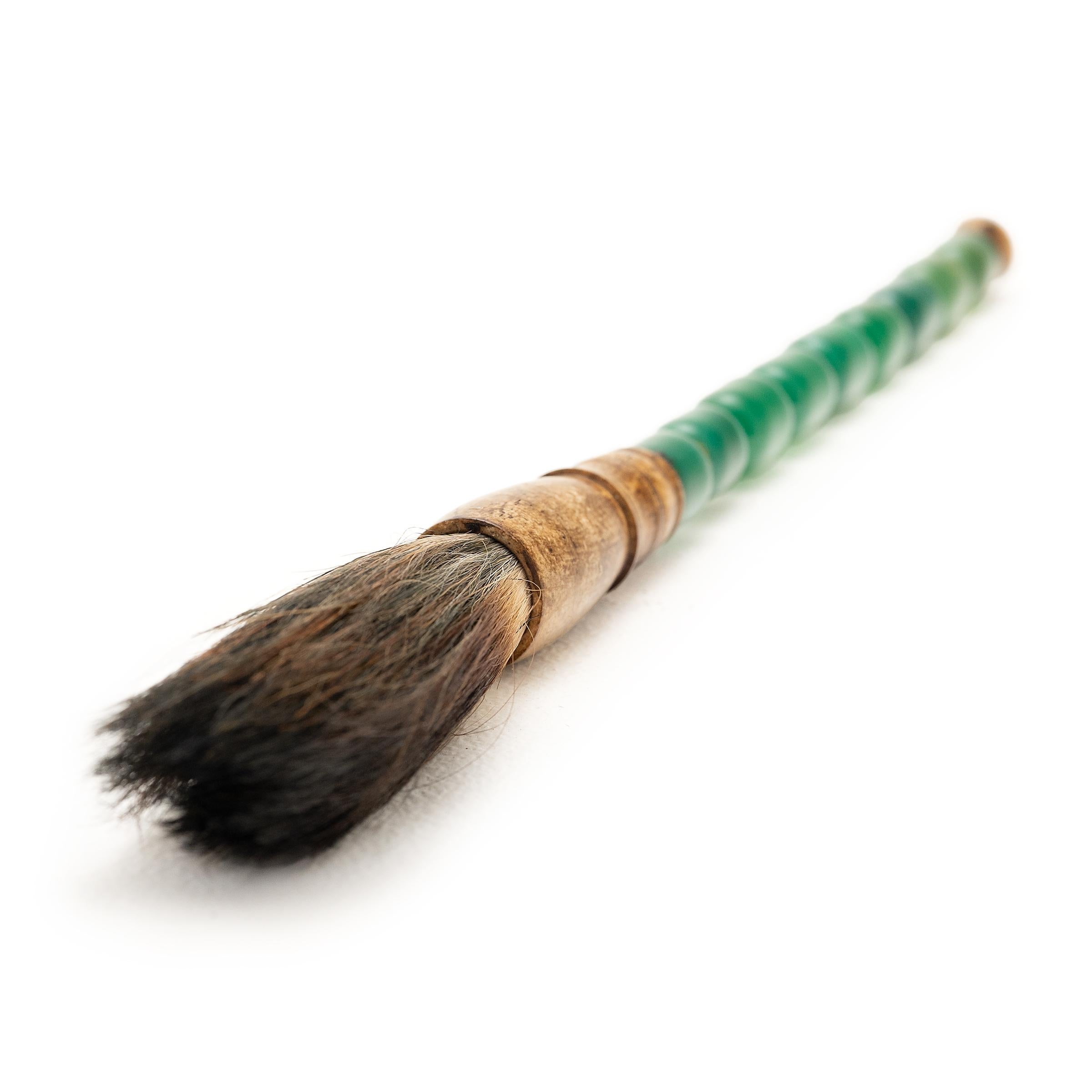 Along with paper, ink, and inkstone, the brush is one of the Four Treasures of the scholar’s studio. Arguably the most important tool, the brush served as a direct link to the artist’s creative spirit. Polished stacked stone beads in a shade of