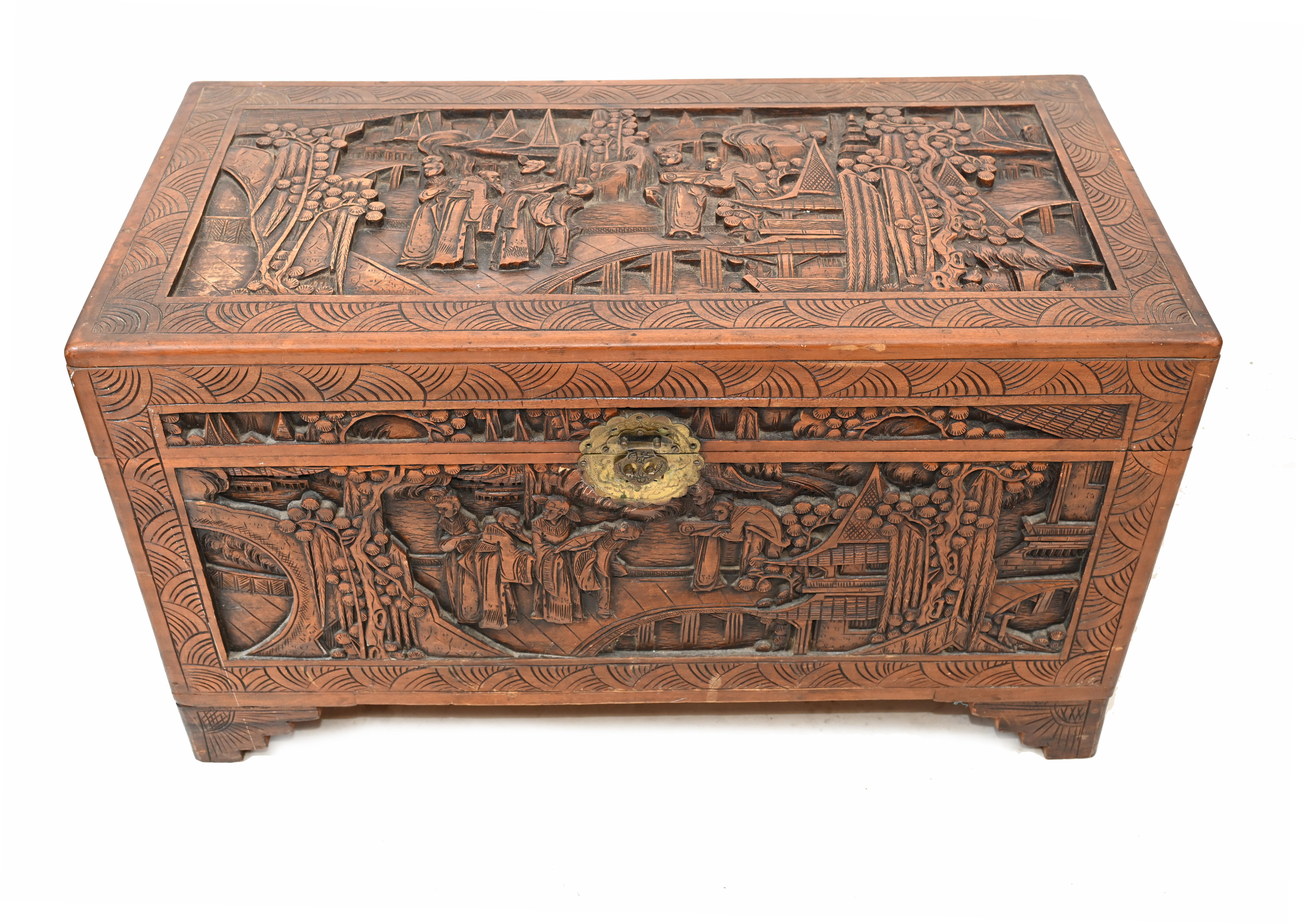 Gorgeous Chinese carved chest crafted from camphor wood
Very detailed carving showing Chinese figurines and a temple
Opens out to reveal lots of storage
Great interiors piece and highly collectable
Can also function as a coffee table
We date