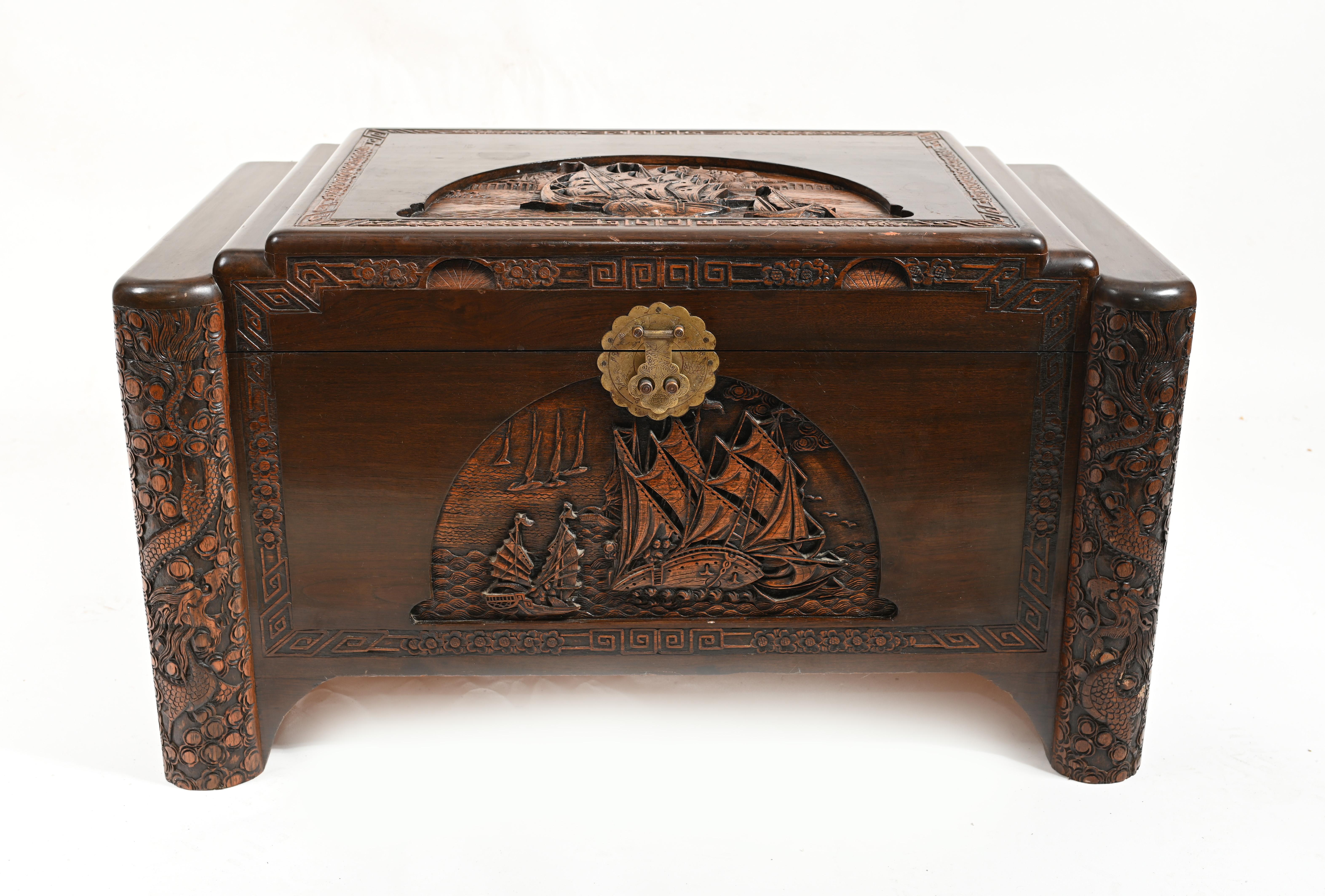 Chinese camphor wood chest finely carved with sailing ships around Hong Kong harbour
Very intricately carved details showing the junk ships 
Would have perhaps functioned as a marriage or dowry chest
 
Offered in great shape ready for home use