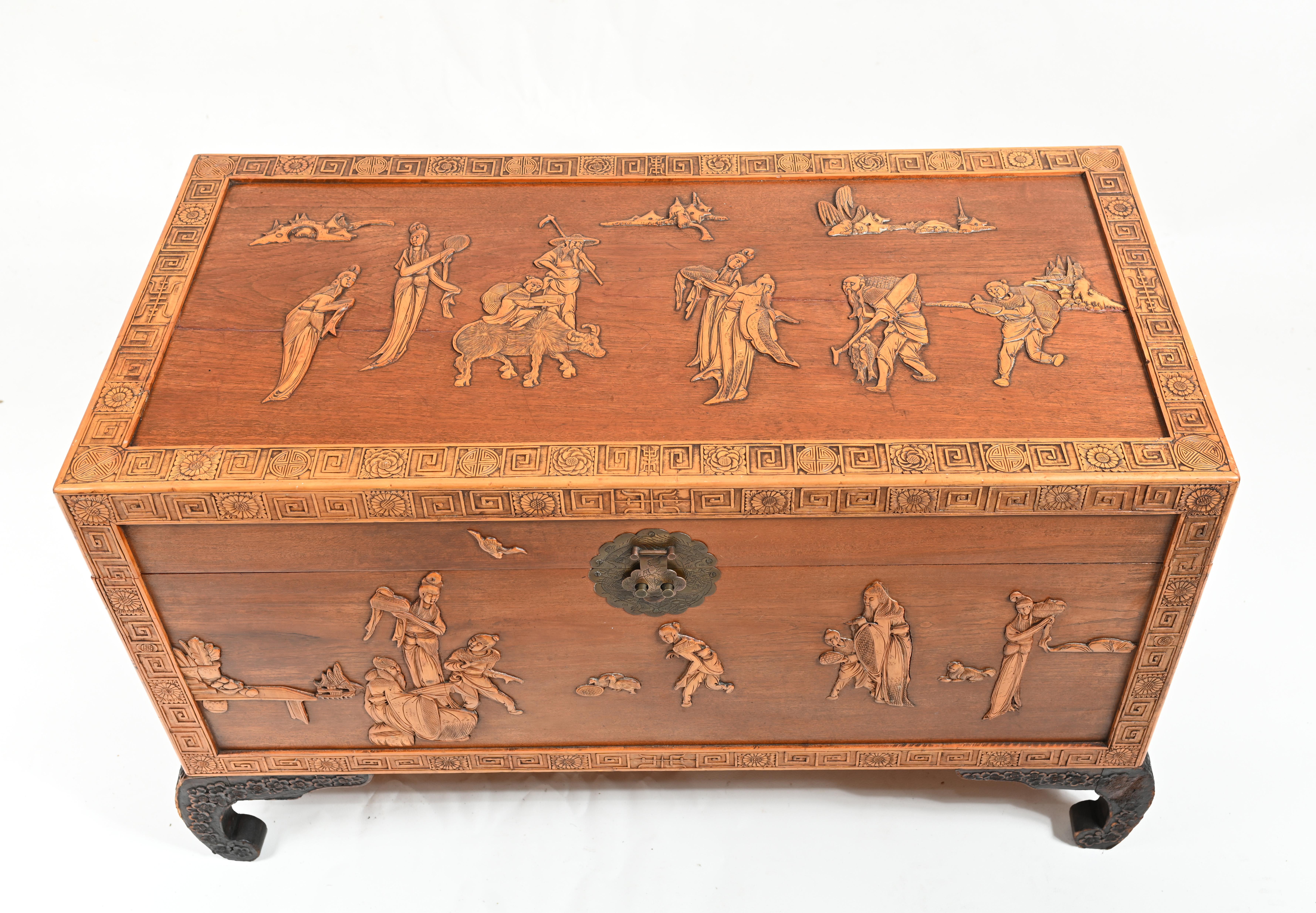 Gorgeous antique Chinese camphor chest 
Chinese camphor wedding trunk with raised carved figure terminating on hardwood bow feet
Carved details are intricate and profuse
circa 1910
We can ship to anywhere in the world 
Offered in great shape