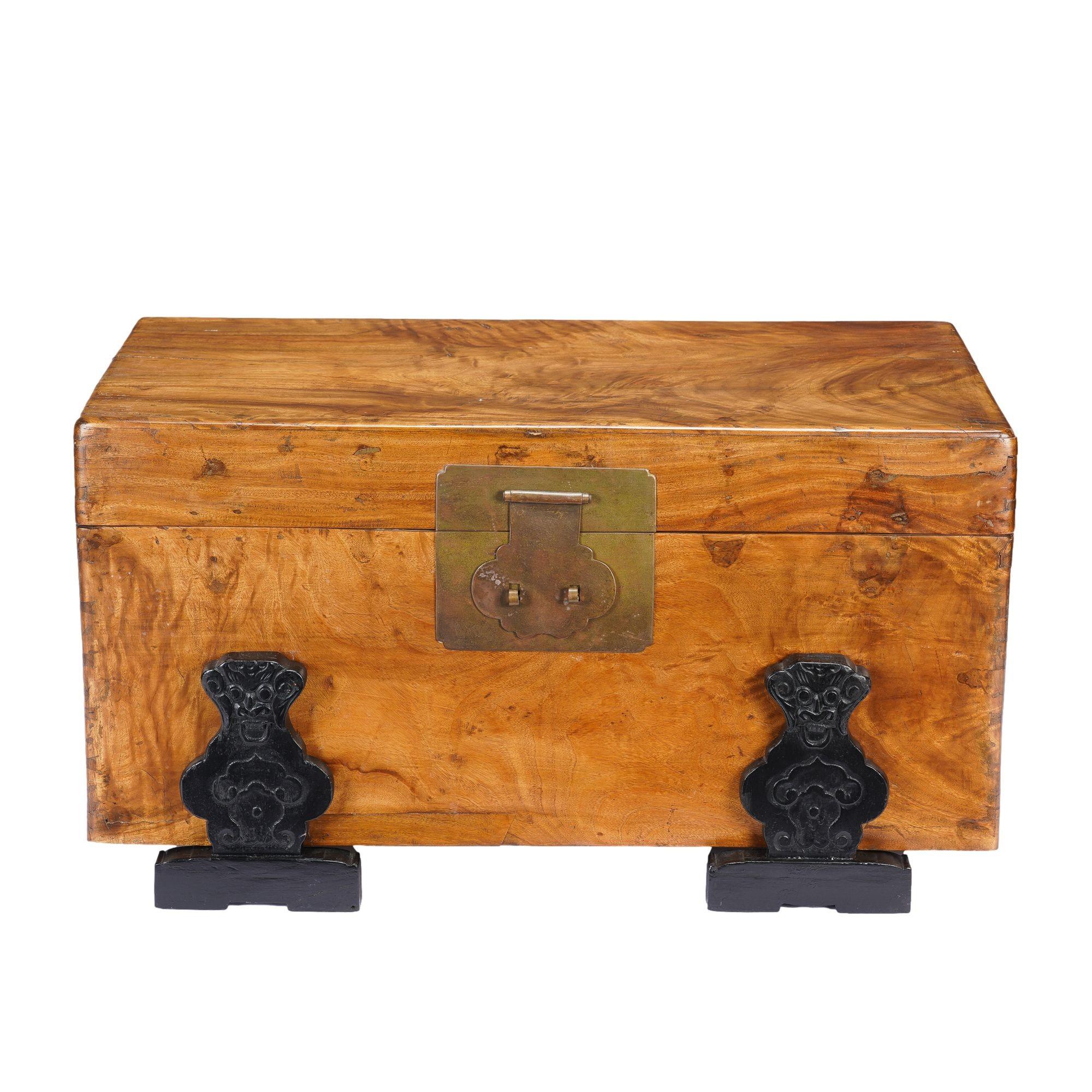 This camphor wood trunk exhibits elegant figuring, brass hardware, and rests on an ebonized hardwood stand with hand carved detailing.
China, made for the Western trade, circa 1820.