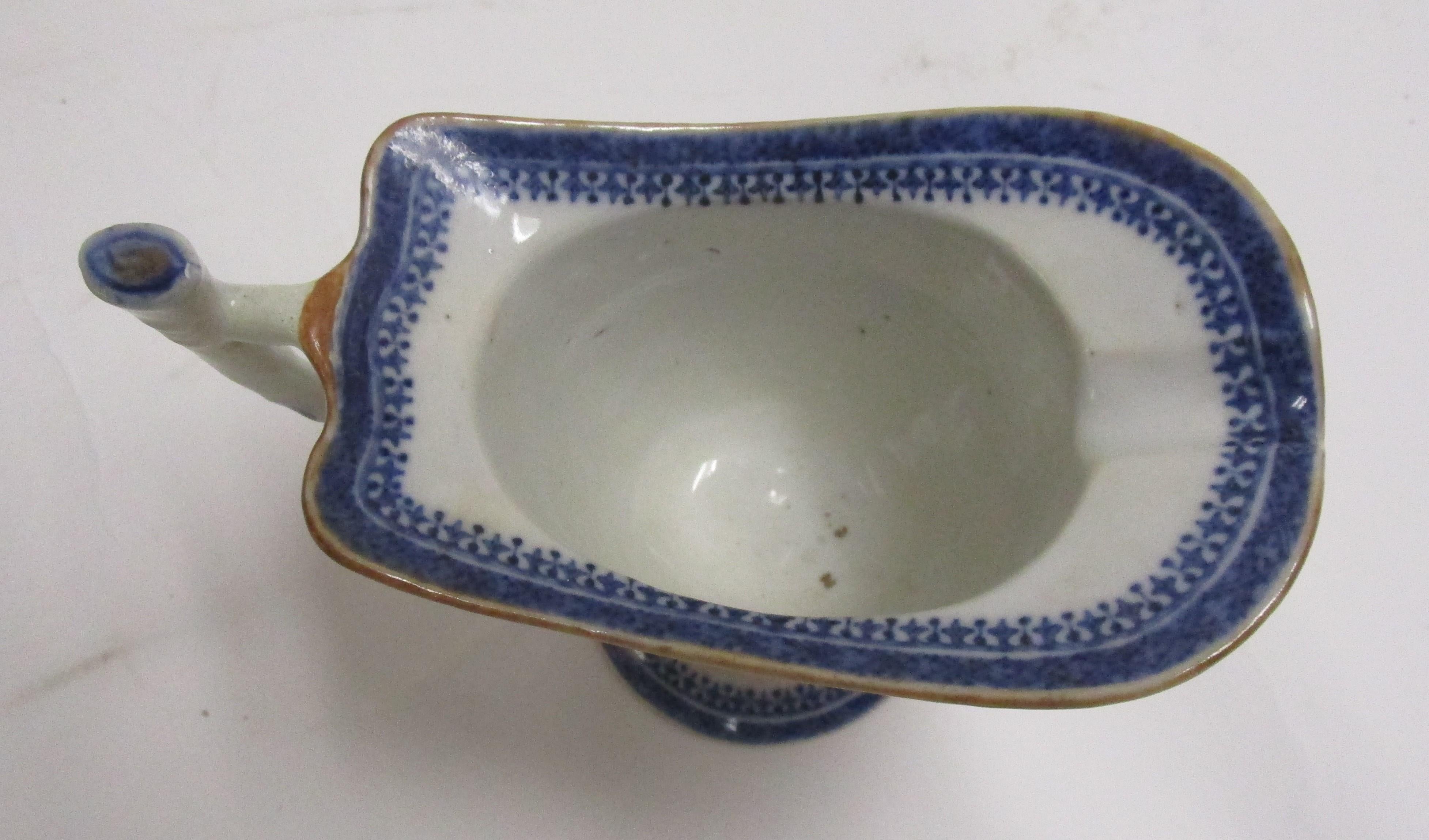 This very fine Chinese Export hand decorated blue and white porcelain creamer is an unusual 