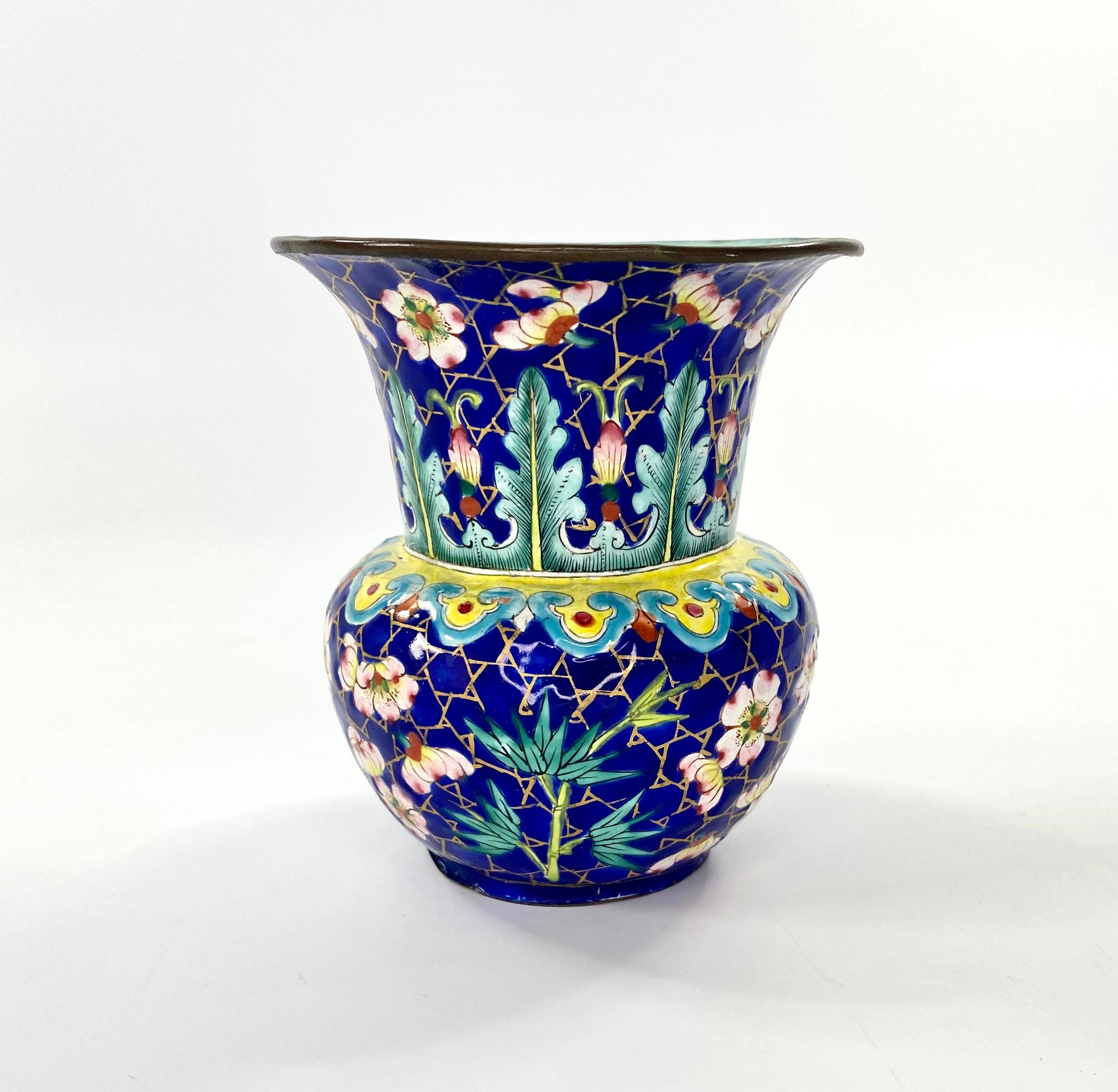 Chinese ‘Canton’ enamel zahdou or Leys jar, late 18th century, Qianlong / Jiaqing Period. The body of the jar painted with flowering prunus, and bamboo, on a gilt ‘cracked ice’ and cobalt blue ground, beneath a continuous yellow Ruyi head motif.