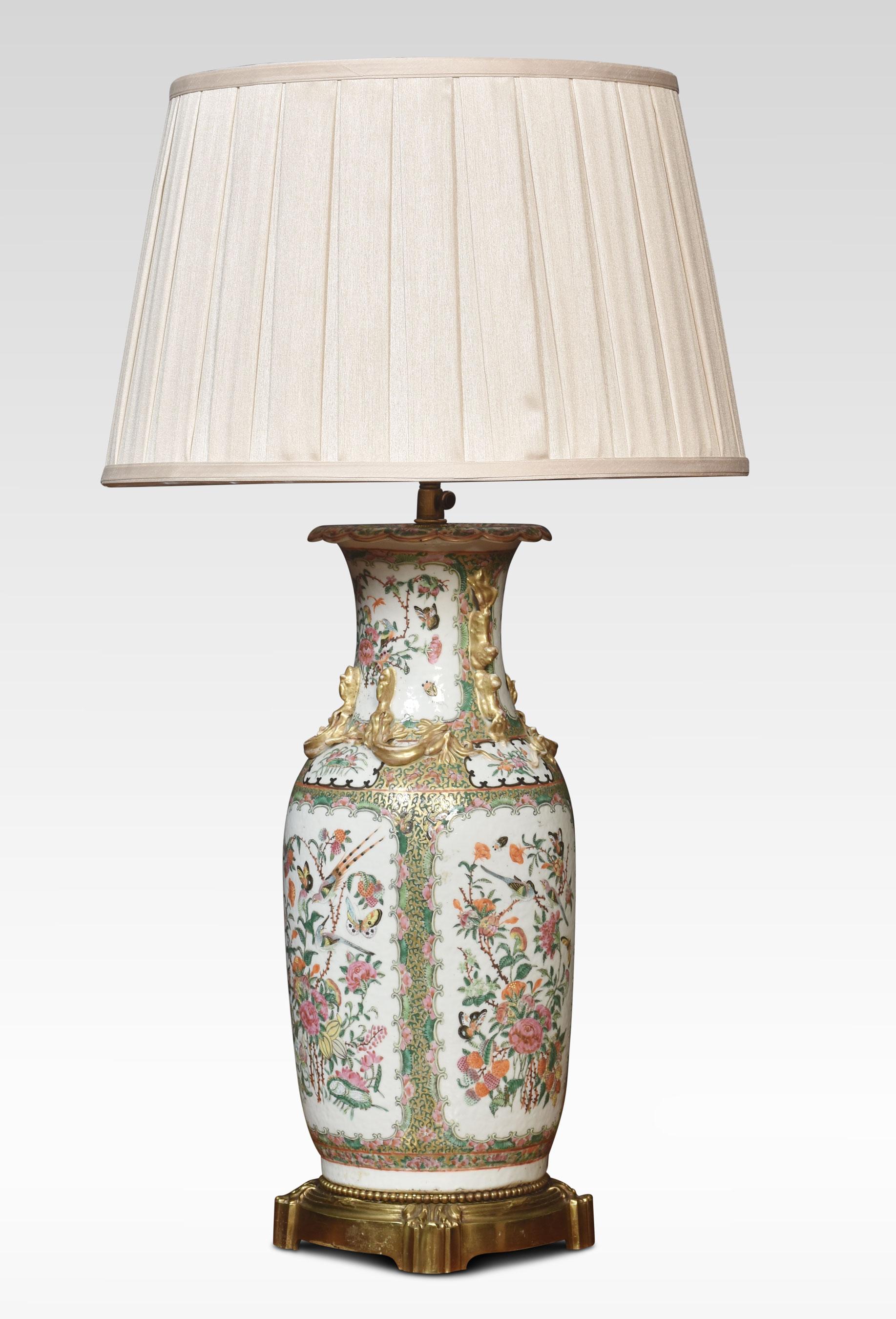 Chinese canton famille rose porcelain vase lamp, decorated with panels of birds, butterflies and native flora, the neck with moulded Chilong and lion dog handles. Converted for electricity.
Dimensions
Height 23 Inches adjustable to 35.5