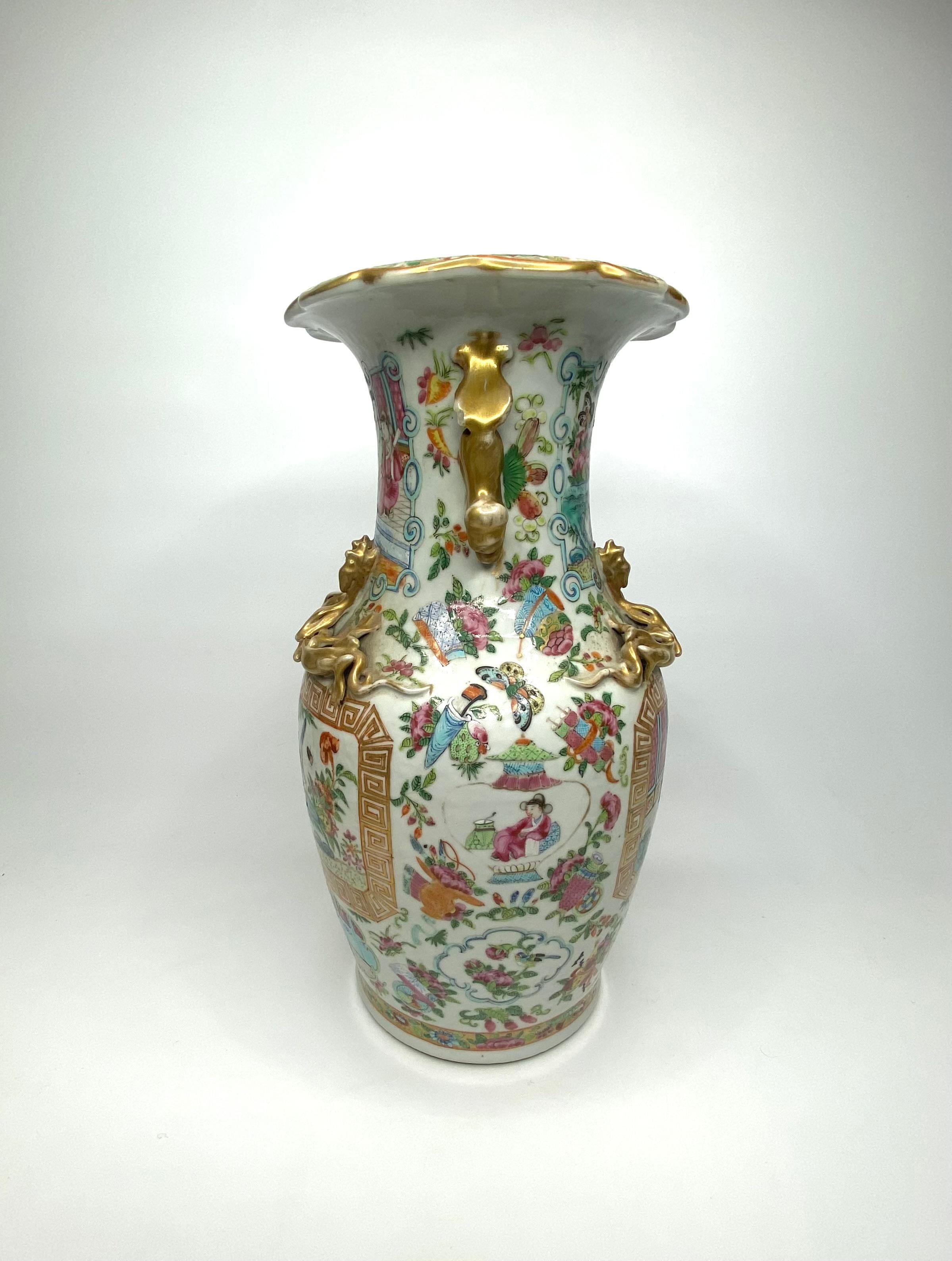 Chinese porcelain vase, c. 1870, Qing Dynasty. Well painted in the Cantonese style, with a twin panels of figures in a garden setting, and the reverse with exotic birds and insects amongst rocks, in a garden; the sides, with vase shaped panels of