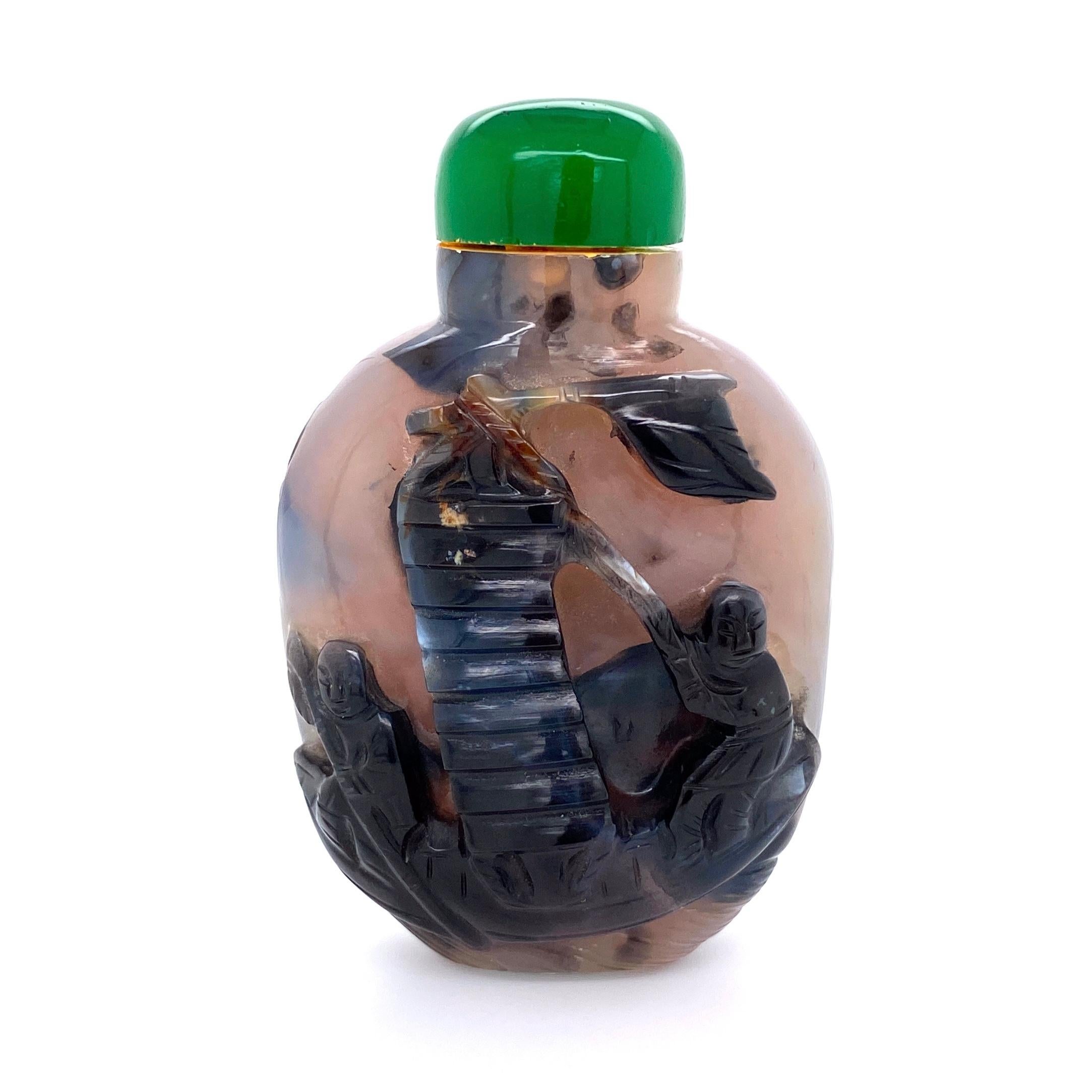 Beautiful antique carved Agate snuff bottle. Hand crafted Figural designs, depicting male figures in a boat. Circa 1900. Approximate 0.71