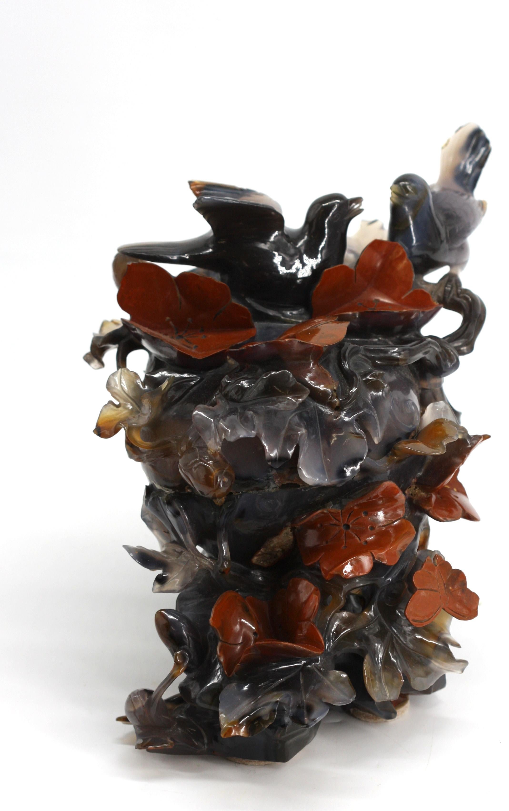 Chinese Carved Agate Birds Atop Foliage Group
The bluish-gray agate also with butterflies and detailed with reddish-orange flowers.
Height 7.5 in., Width 12 in., Depth 7.5 in.
Condition Report
Good condition