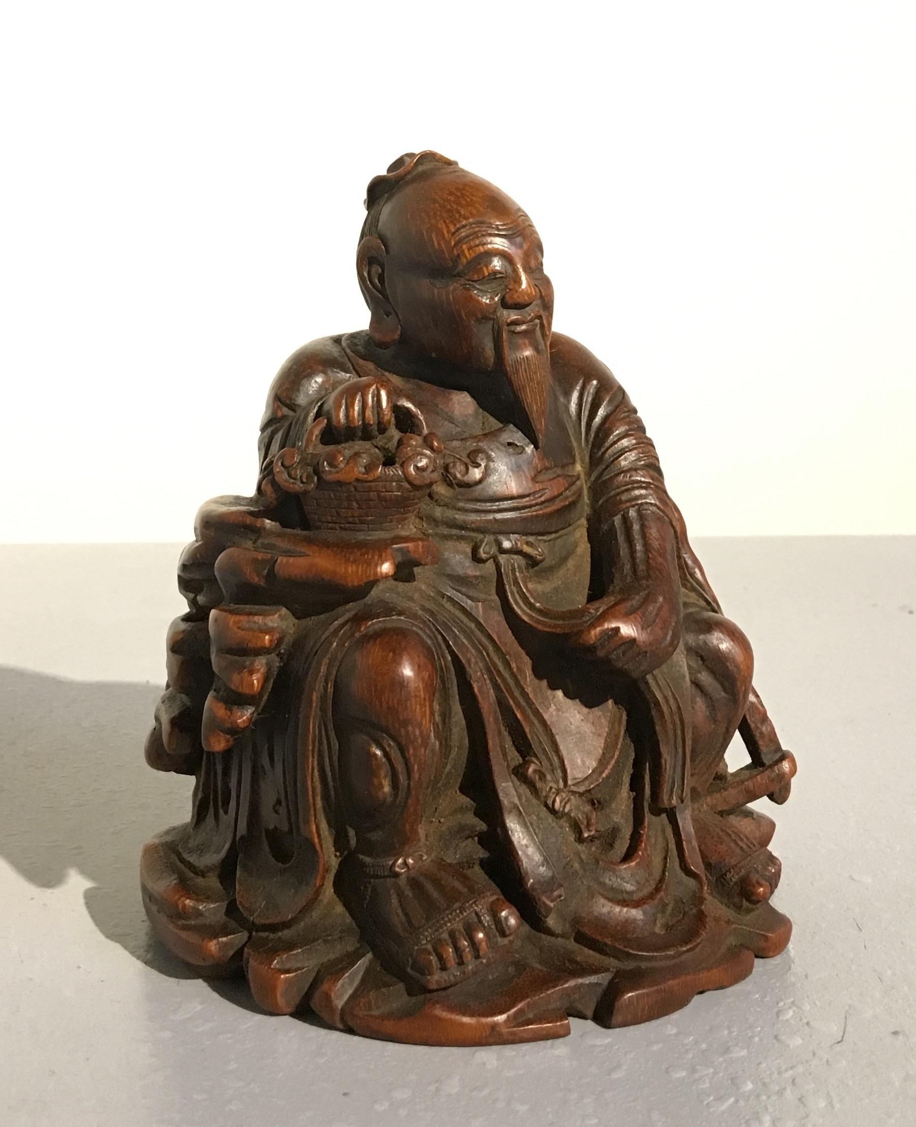 A sweet and lovely Chinese bamboo carving of the sage Dongfang Shuo, mid-Qing dynasty, 18th century, China.

Well carved form a single section of bamboo, the carving depicts the historical Han dynasty figure Dongfang Shuo. The sage, scholar, court