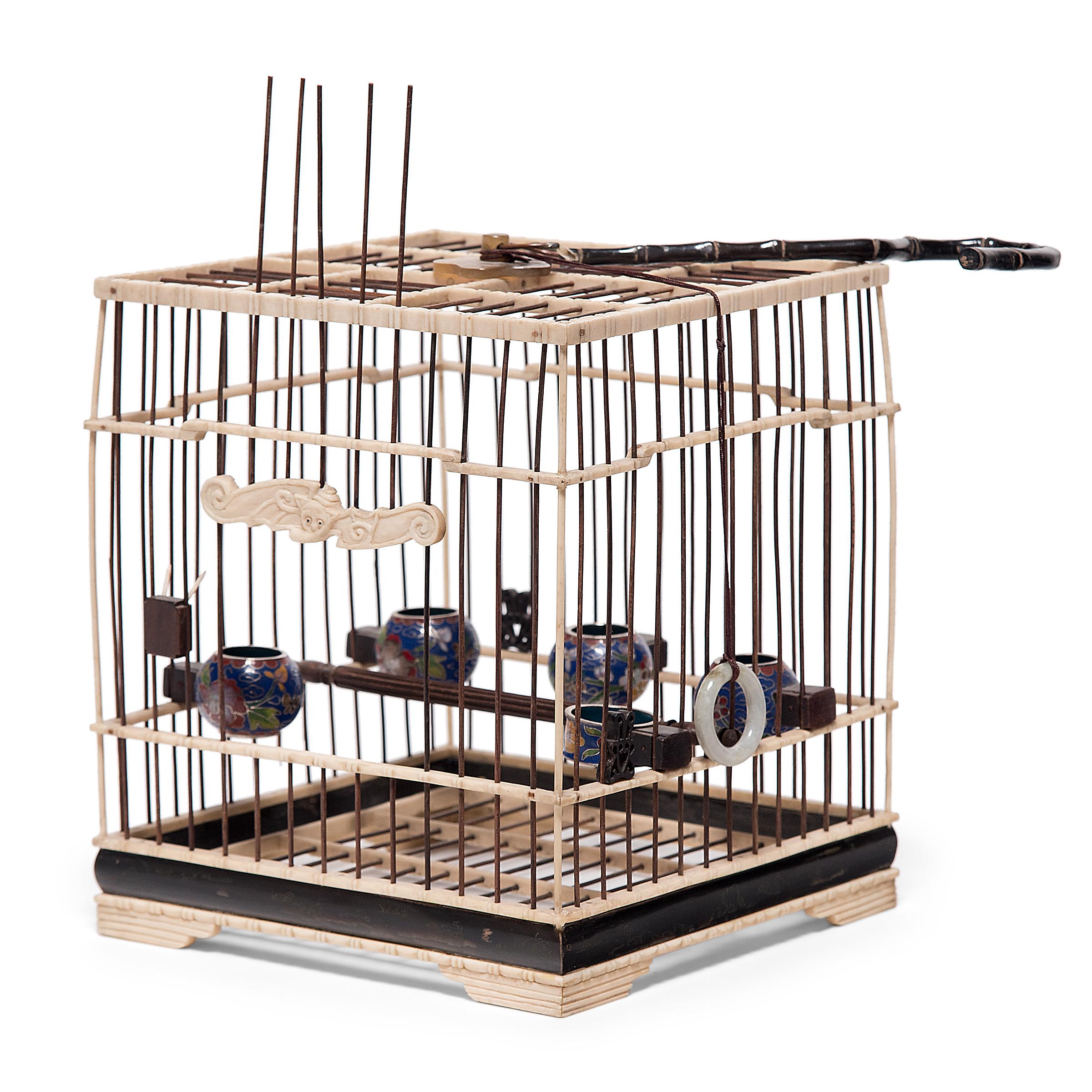 Perfectly proportioned and delightfully ornate, this fine birdcage was once home to the pet of a Qing-dynasty aristocrat. Dated to the mid-19th century, this square birdcage is carefully assembled of thin wooden rods anchored by a carved bone frame.