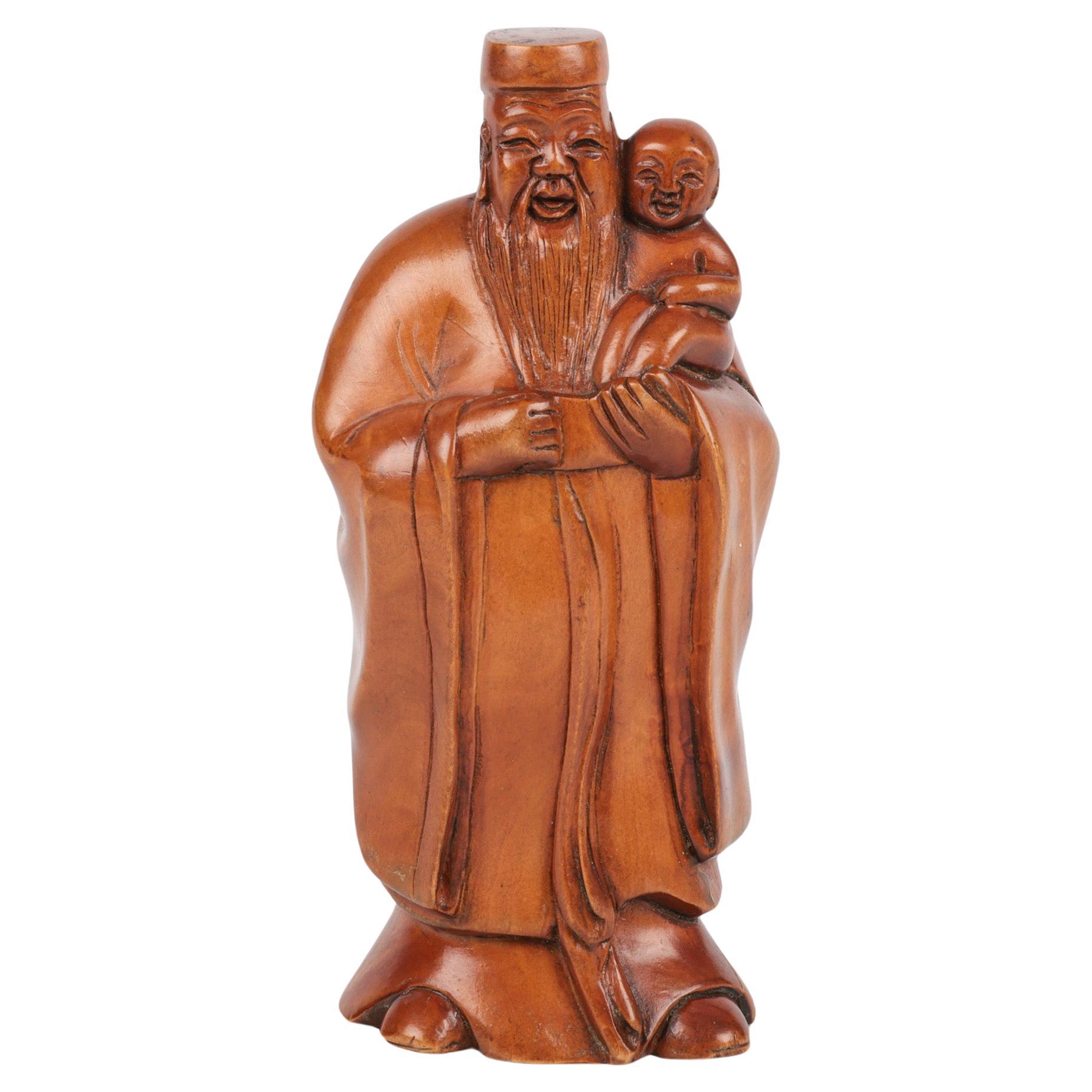 Chinese Carved Boxwood Immortal Holding Child