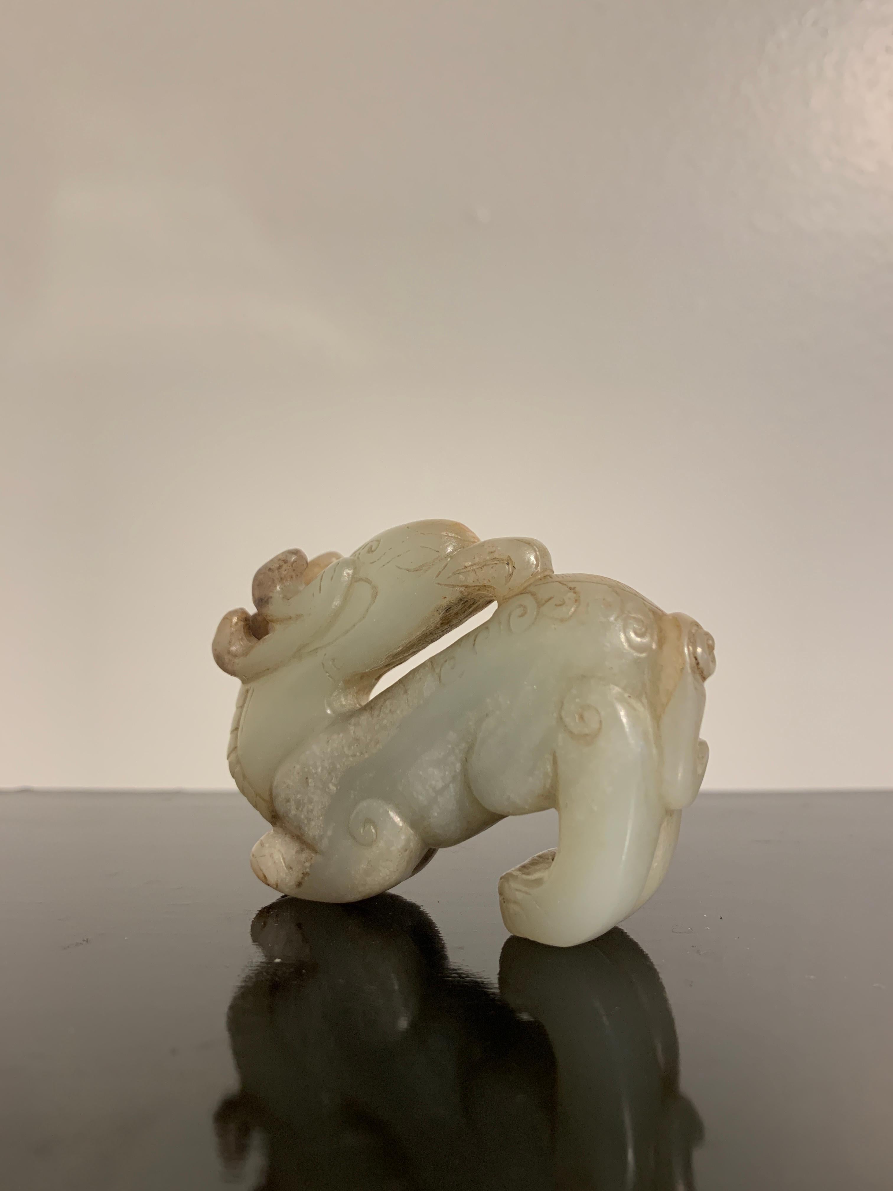 Hand-Carved Chinese Carved Celadon and Russet Jade Mythical Animal, Ming Dynasty or Earlier For Sale