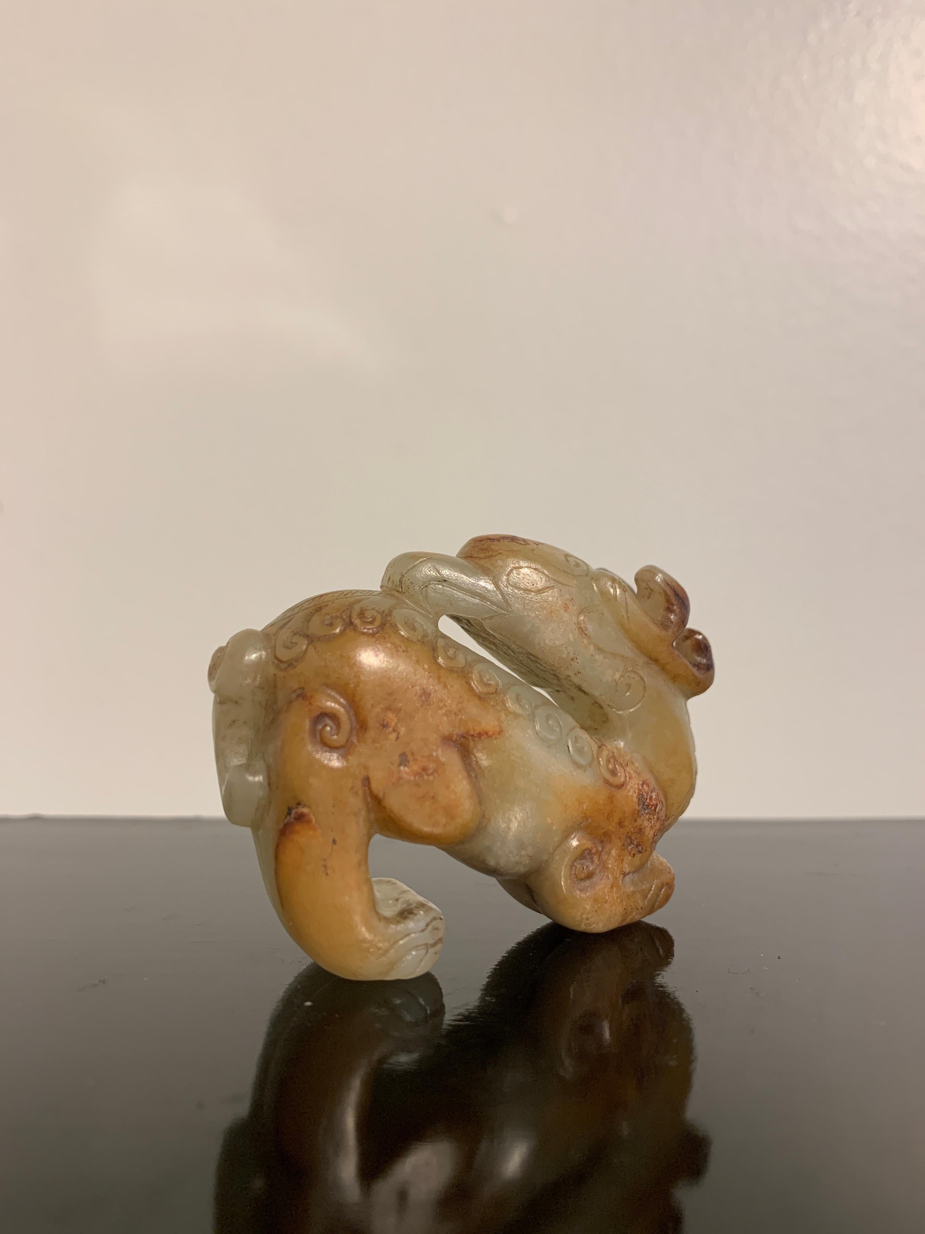 Chinese Carved Celadon and Russet Jade Mythical Animal, Ming Dynasty or Earlier In Good Condition For Sale In Austin, TX