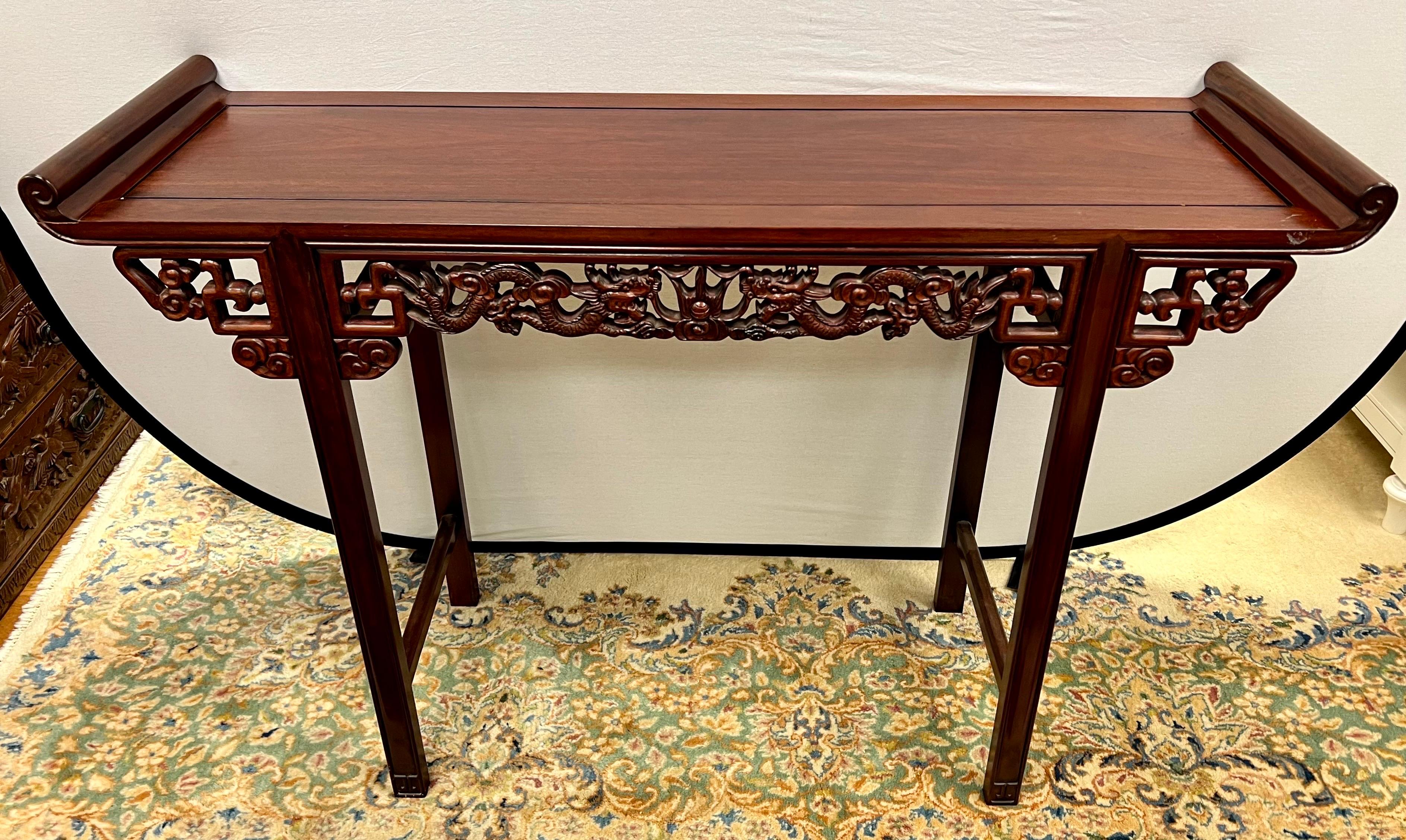 Chinese altar table with beautiful hand carved open fretwork with dragons on the front and back. Use it as an entry console or sofa table as well as a buffet table.