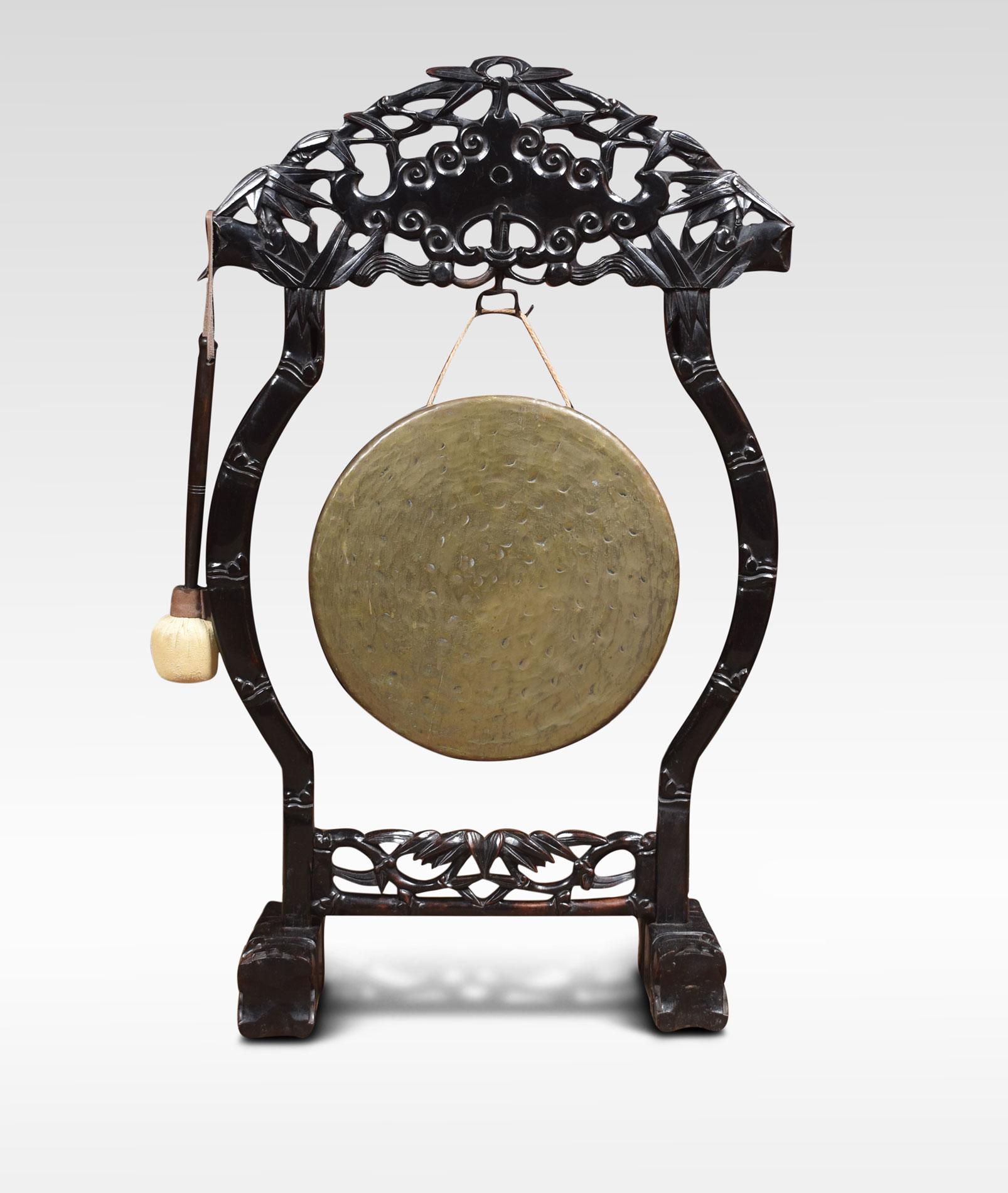 Chinese dinner gong, the profusely carved frame with pierced decoration, supporting the original brass gong and beater. All raised up on stylised block feet.
Dimensions:
Height 36 inches
Width 22 inches
Depth 8.5 inches.