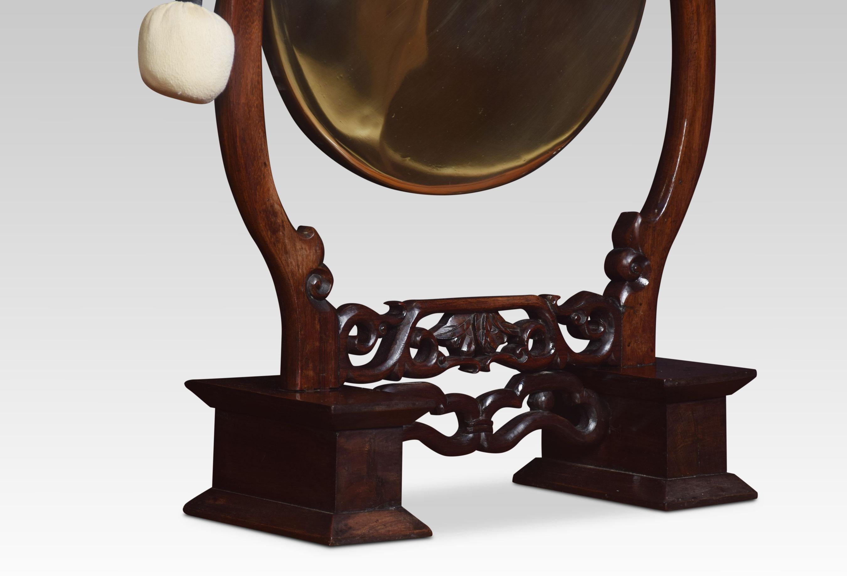 Chinese hardwood framed dinner gong, the frame carved with scrolls supporting the original brass gong. Together with beater.
Dimensions:
Height 34 inches
Width 18.5 inches
Depth 8 inches.