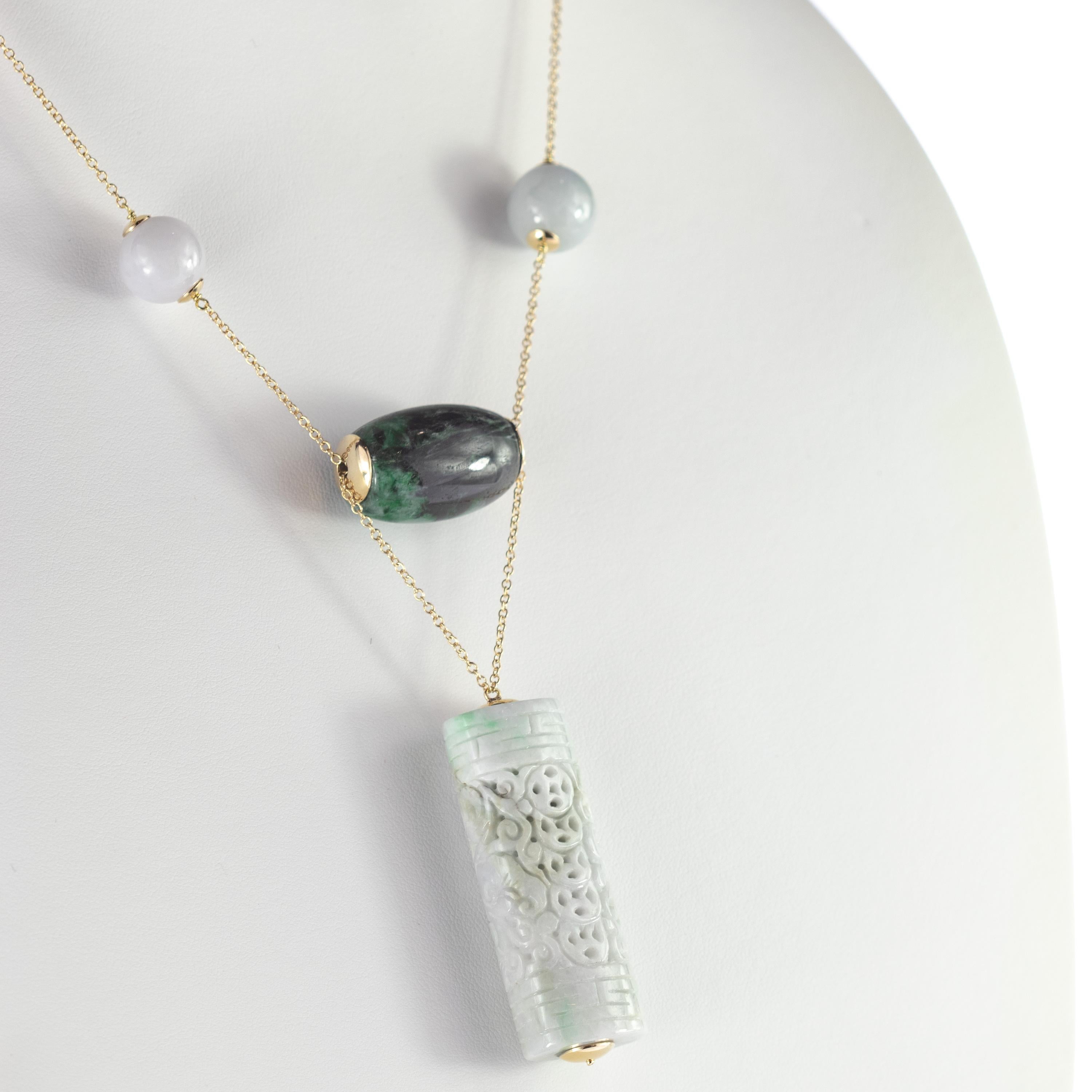 Astonishing and breathtaking iconic  308.5 carats lavender and Omphacite Jade necklace with a stunning carved medallion in a tube shape full of power, energy and stories. The carved design symbolised the traditional symbols and artisan decoration