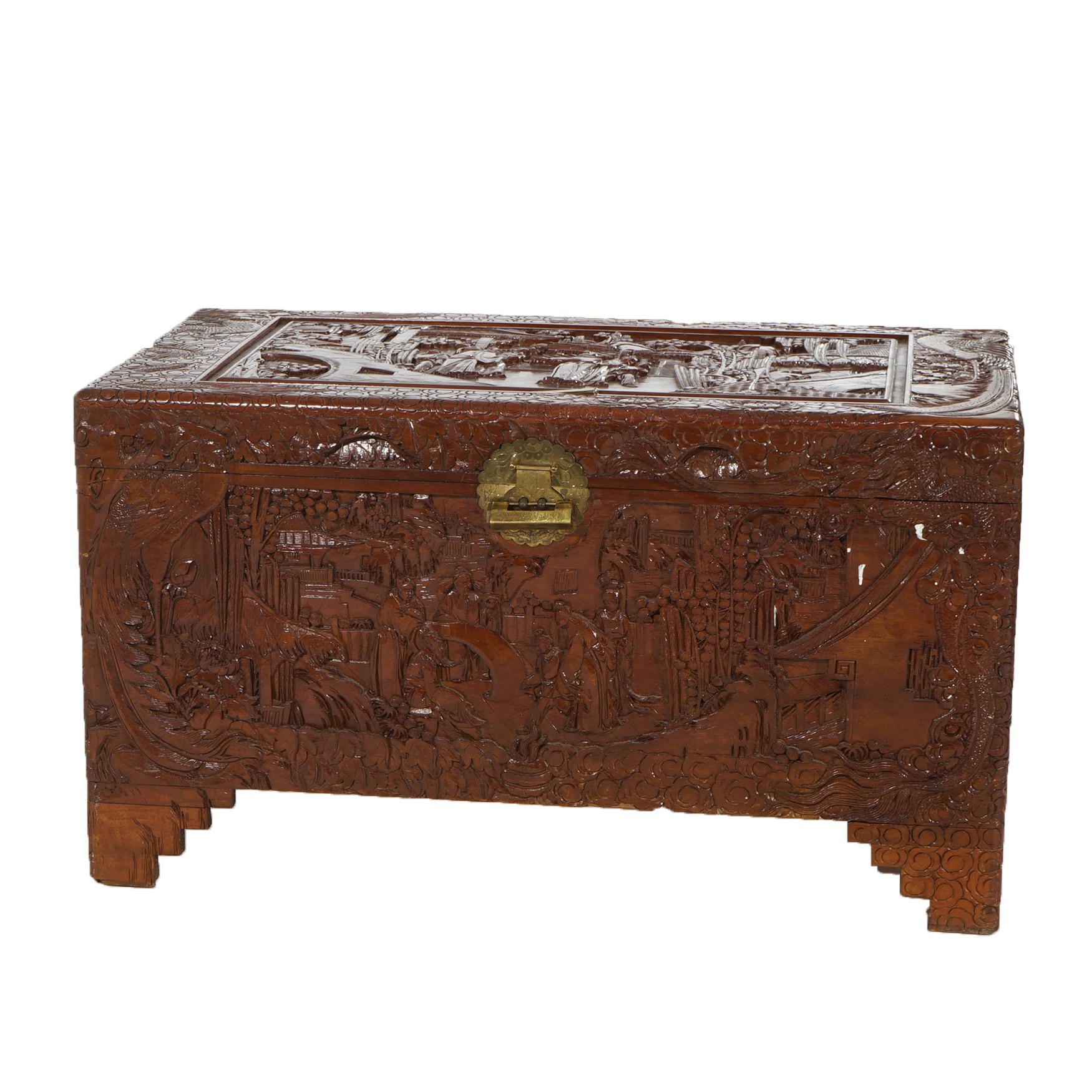 ***Ask About Reduced In-House Delivery Rates - Reliable Professional Service & Fully Insured***
Chinese Deeply Carved Hardwood Figural Blanket Chest with Village Scene in Relief and Brass Hardware, Raised on Stylized Bracket Feet, 20thC

Measures-