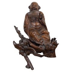 Chinese Carved Hardwood Sculpture of Zhongli Quan on Naturalistic Rootwood Stand